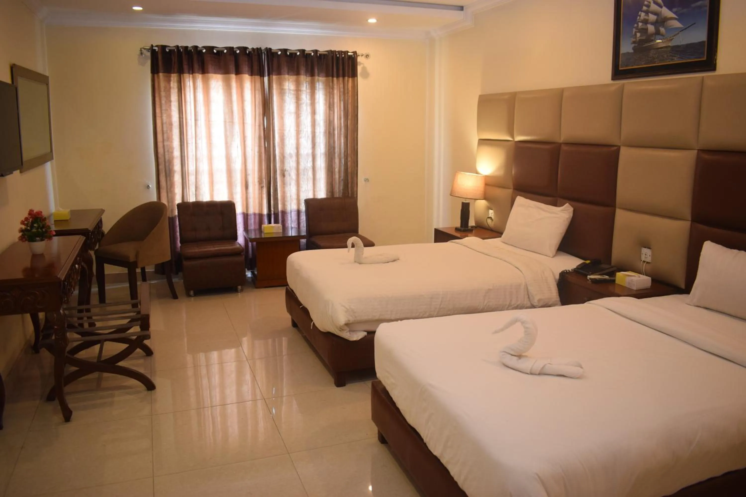 Bed in Grand Millennium Hotel