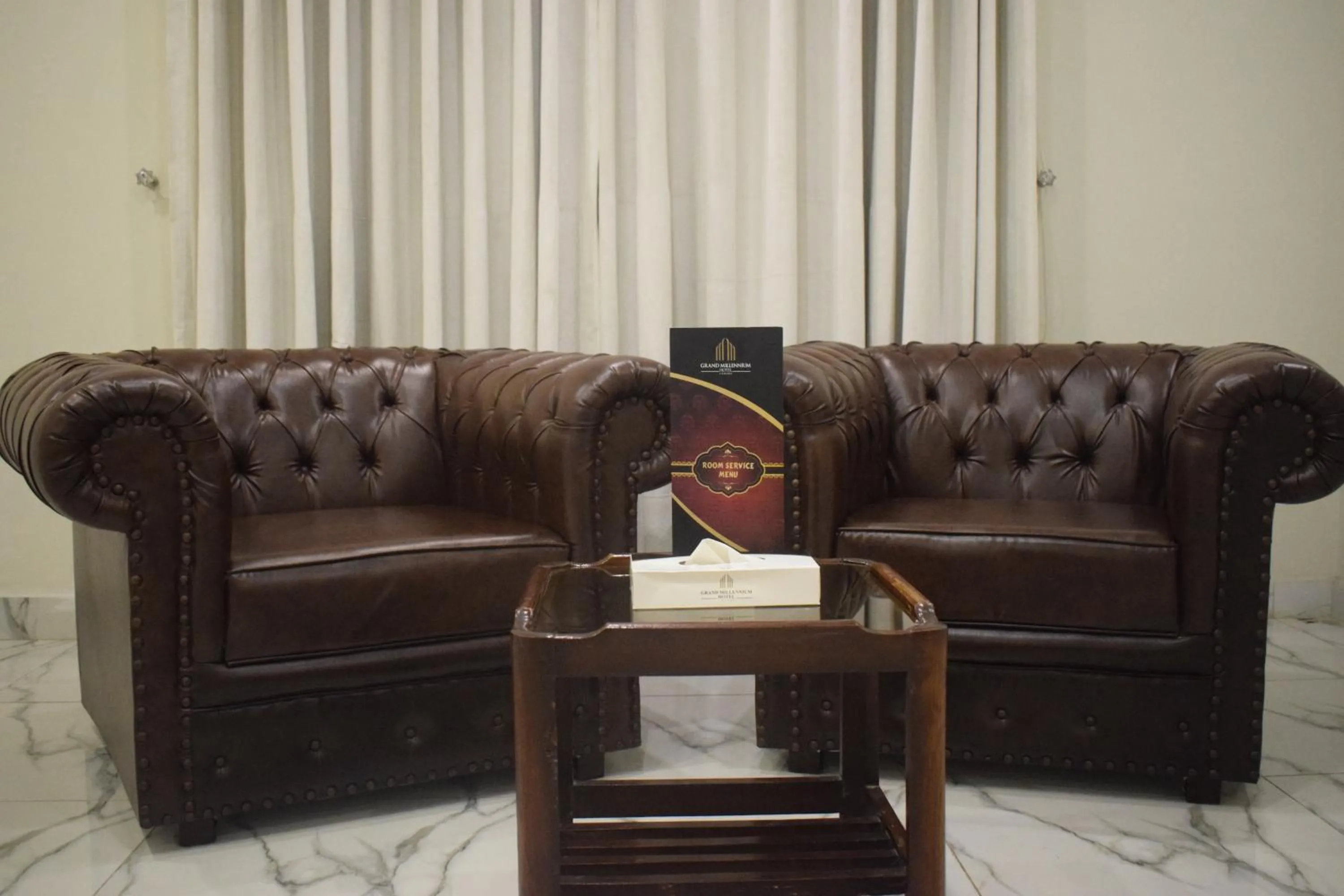 Living room in Grand Millennium Hotel