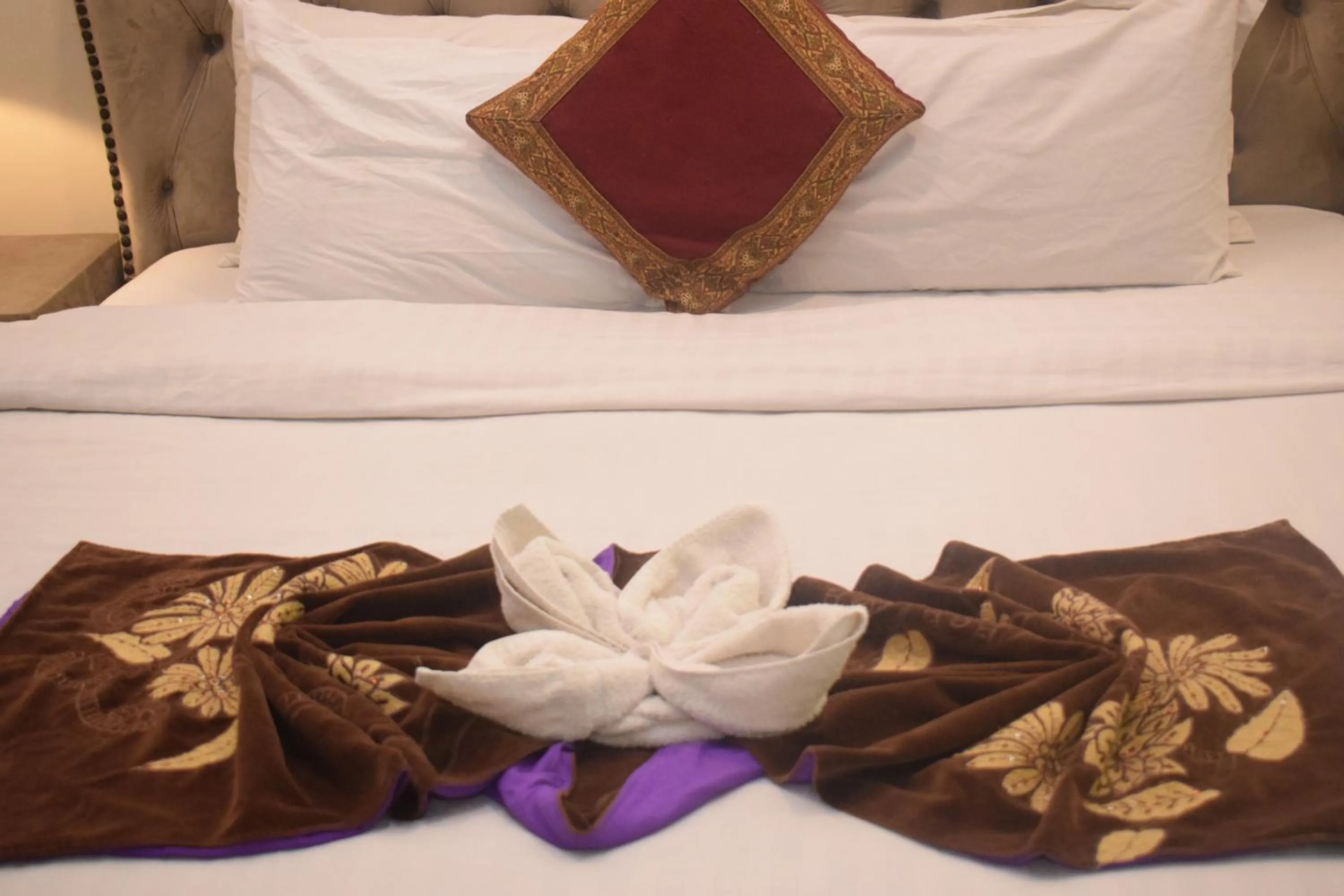 Bed in Grand Millennium Hotel