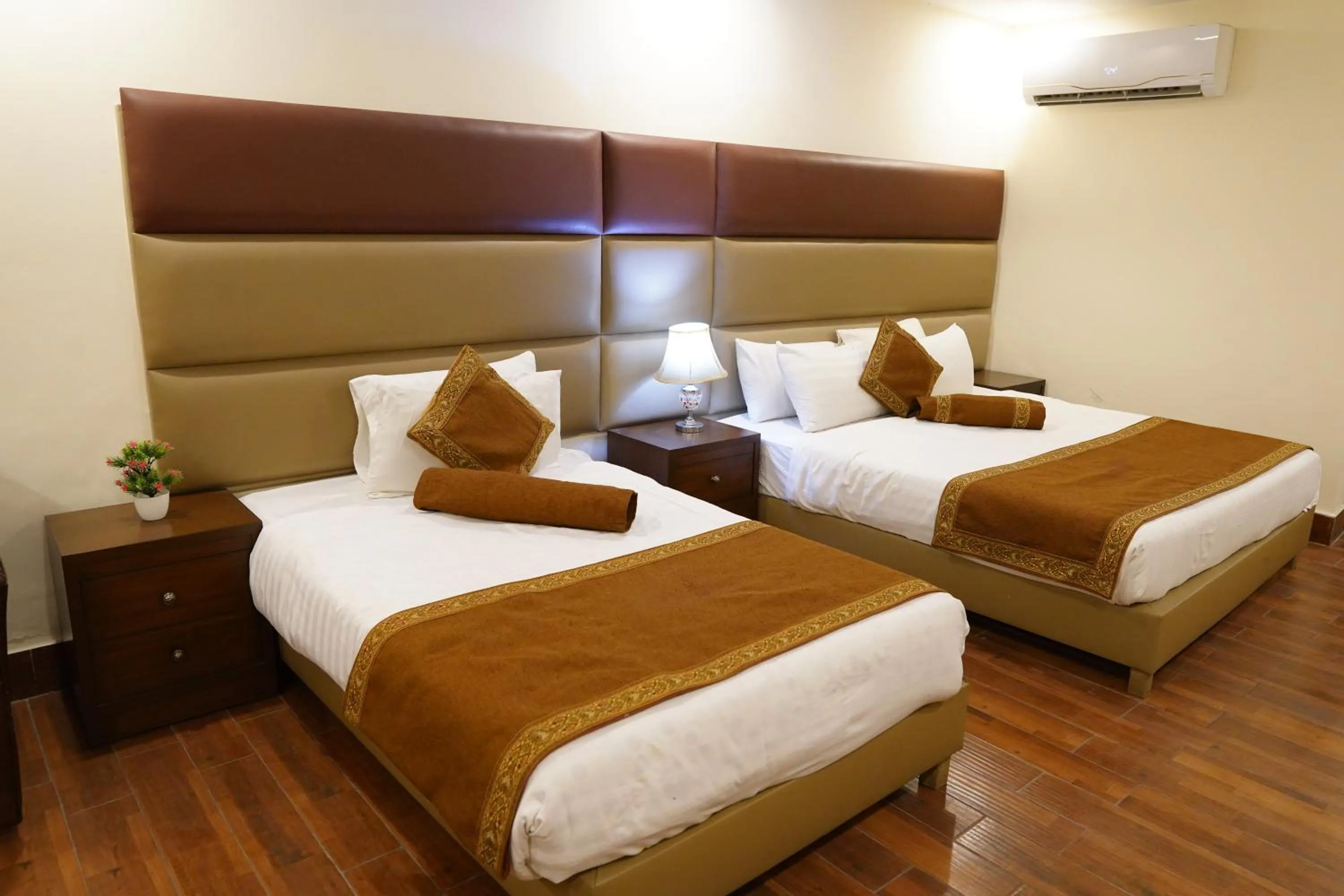 Bed in Grand Millennium Hotel