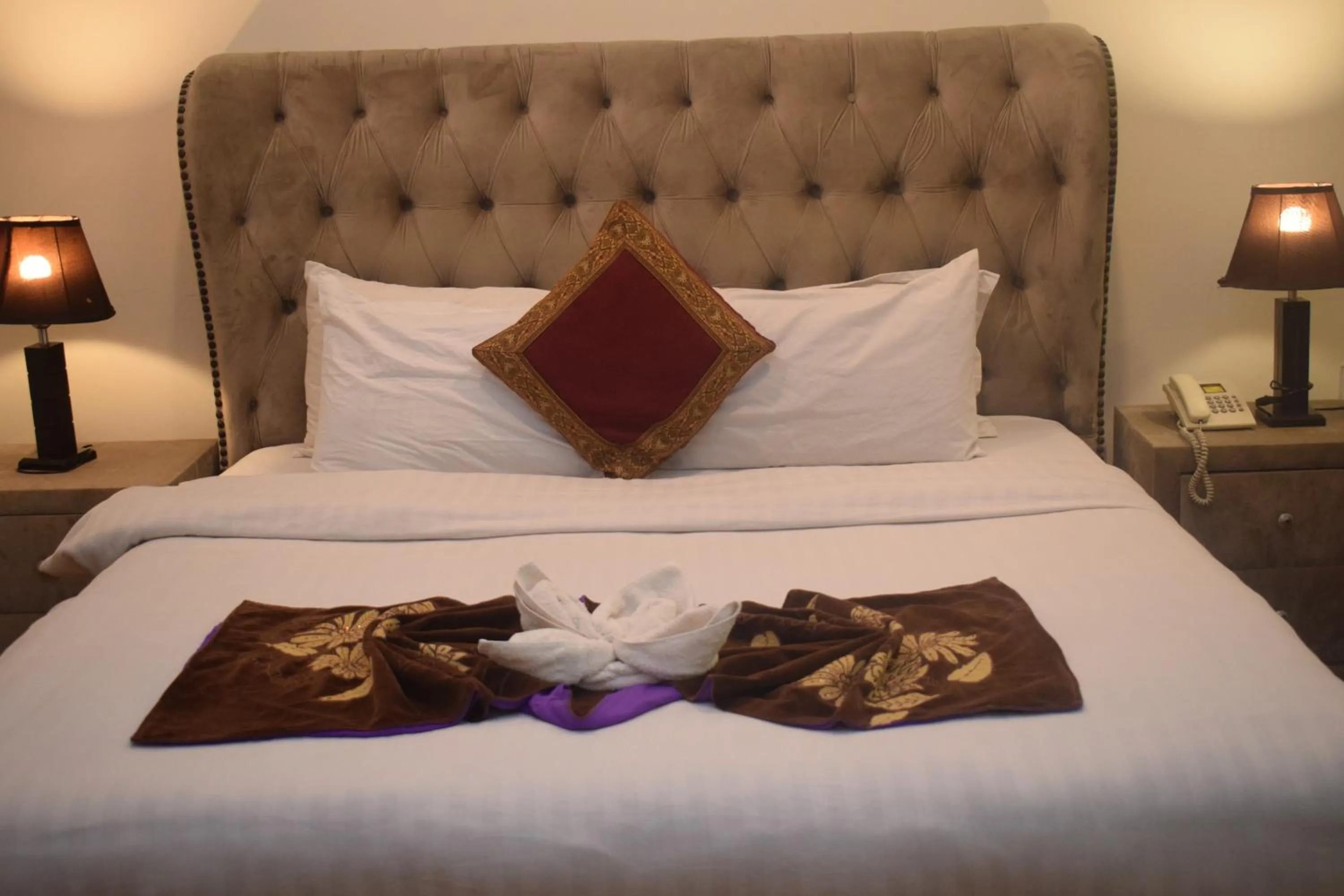 Bed in Grand Millennium Hotel