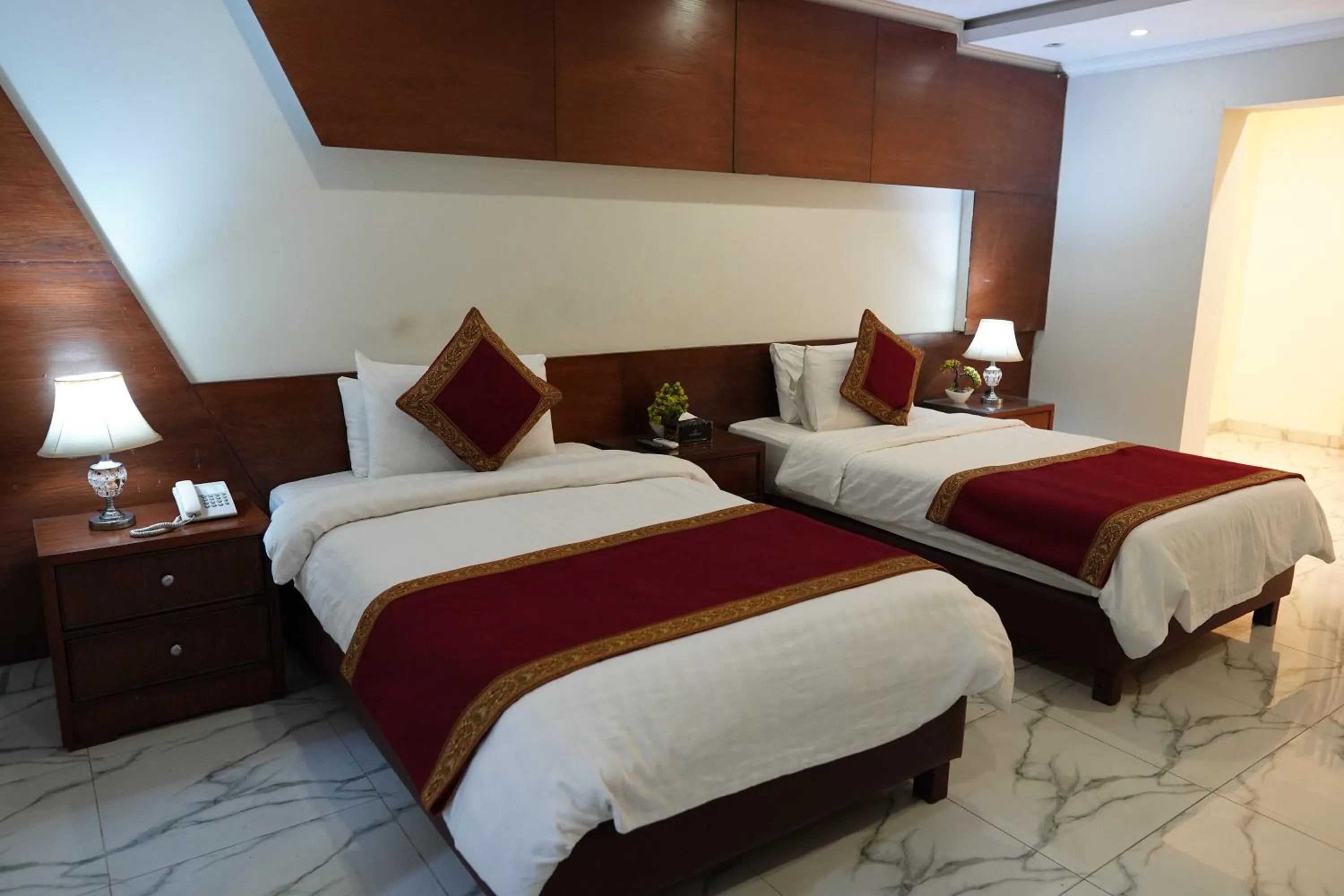 Bed in Grand Millennium Hotel