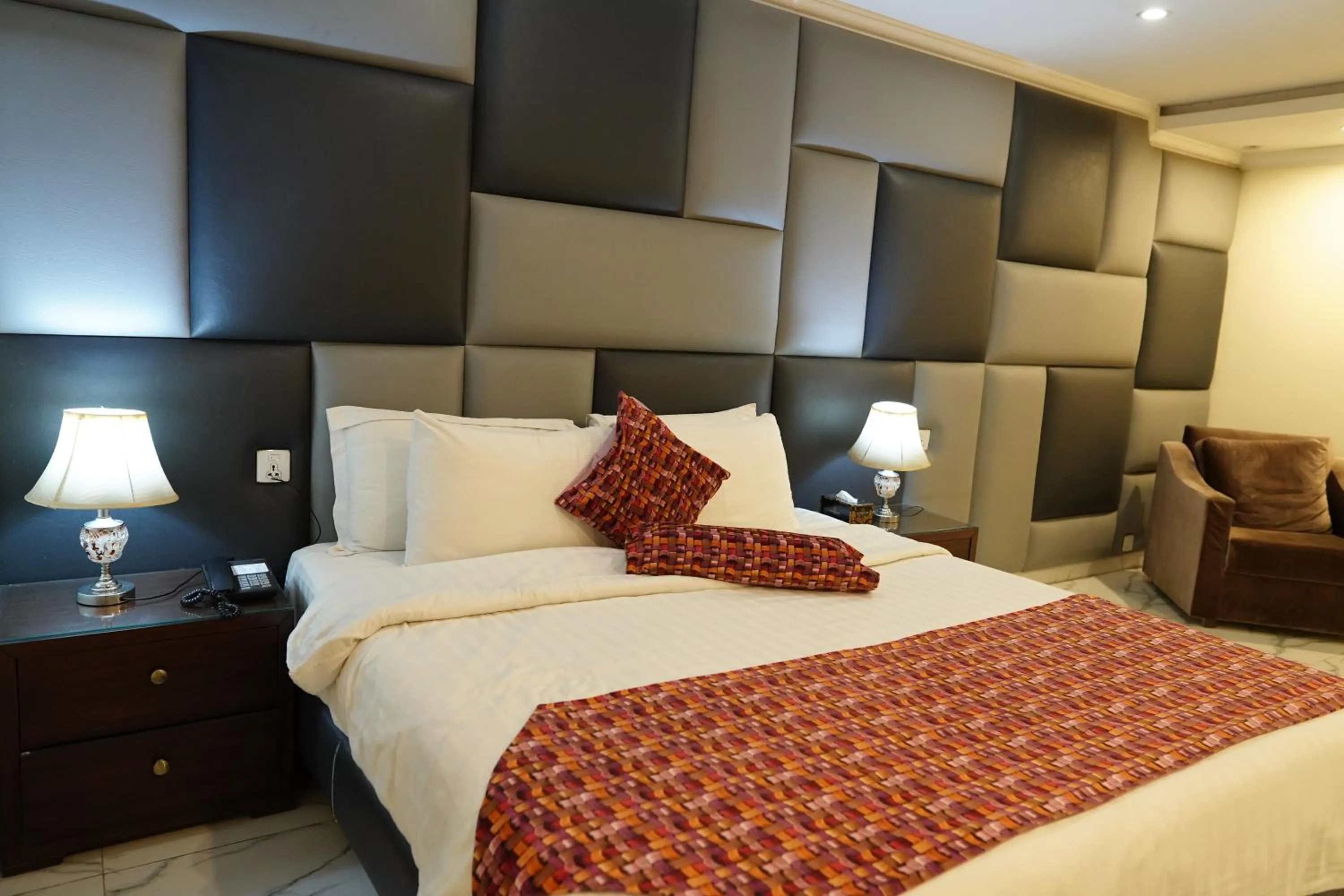 Bed in Grand Millennium Hotel