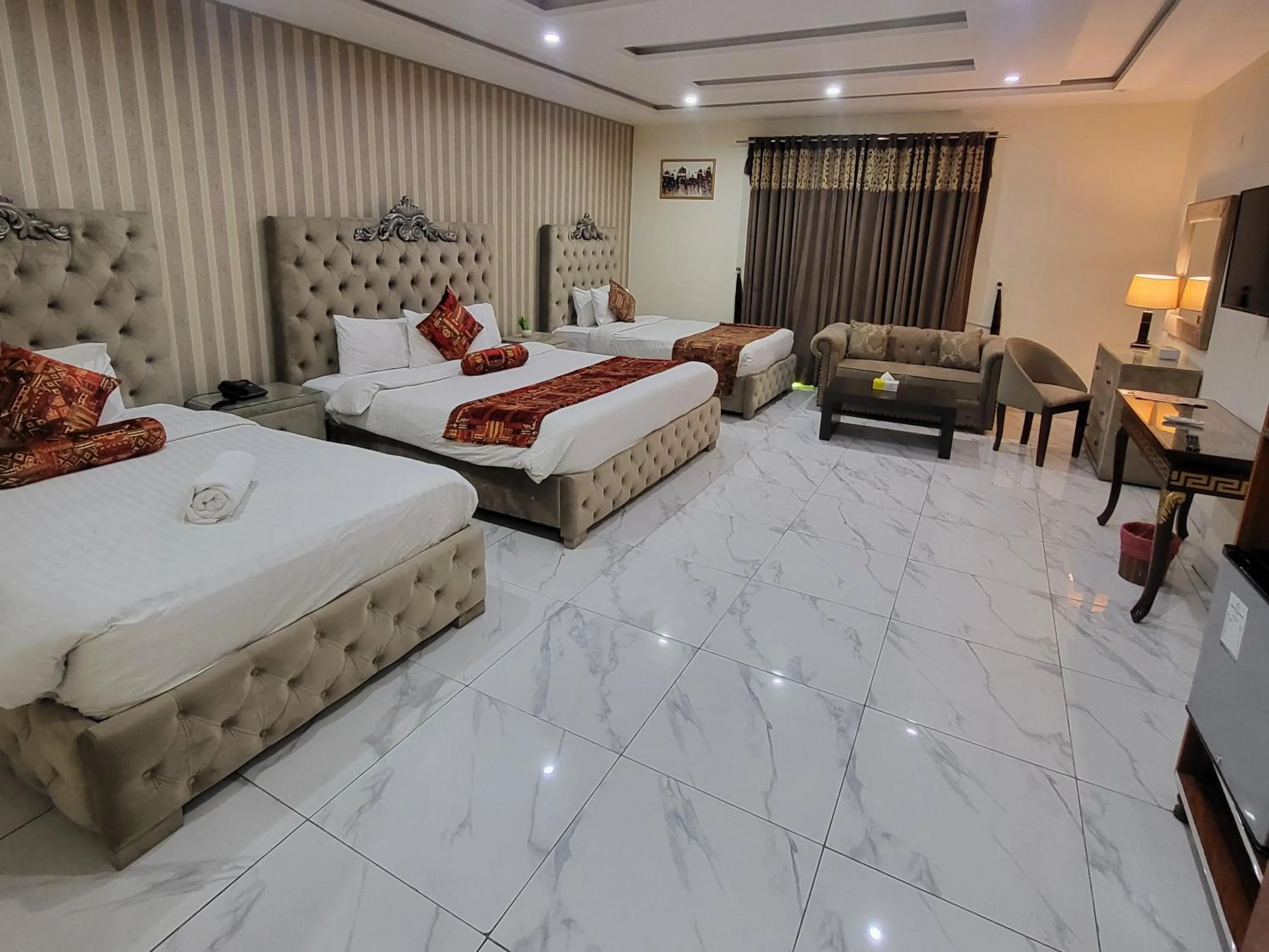 Bed in Grand Millennium Hotel