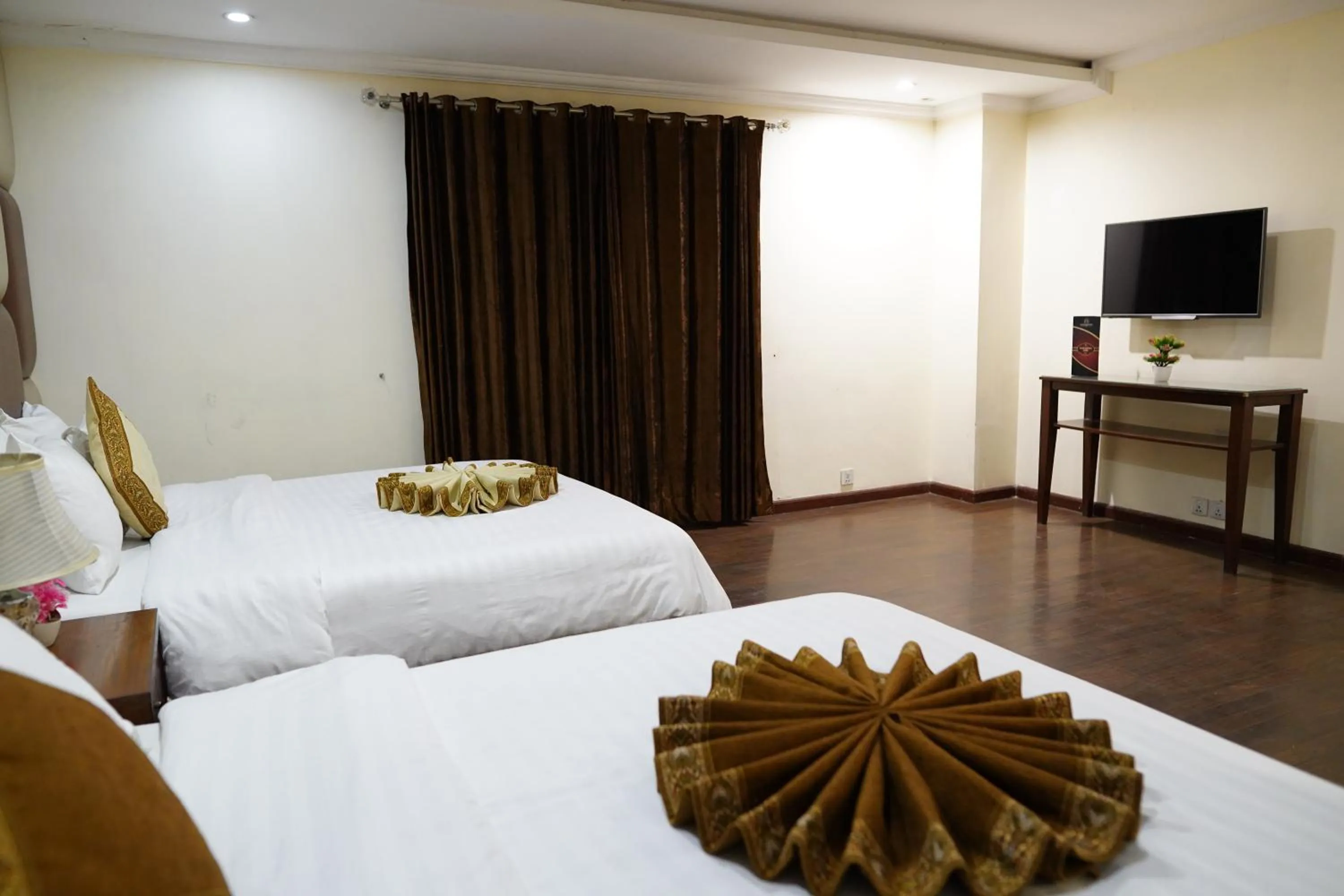 Bed in Grand Millennium Hotel