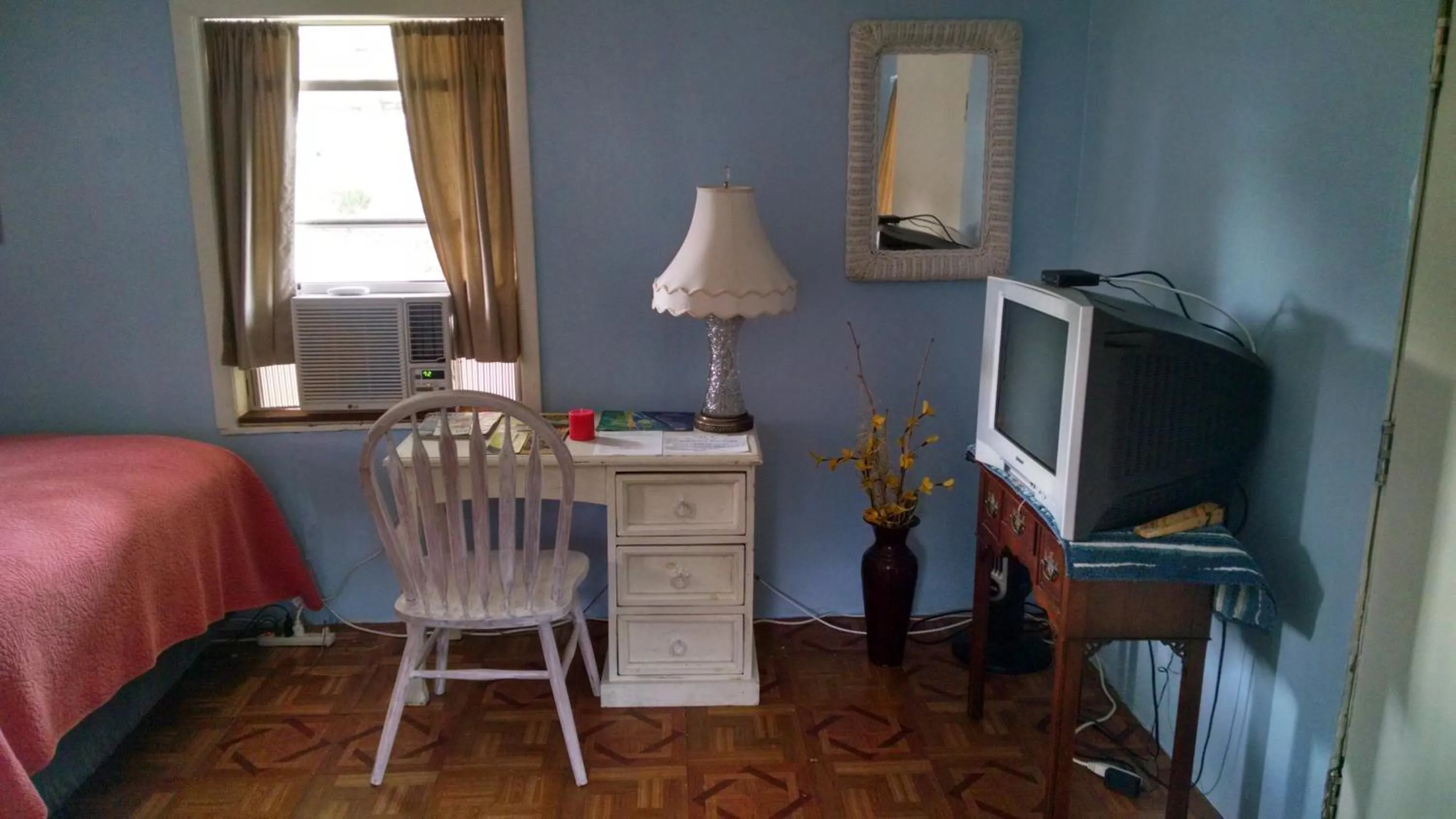 Seating area in 1 Beige Cozy Bungalow or 1 White Cozy Efficiency Cottage in Titusville