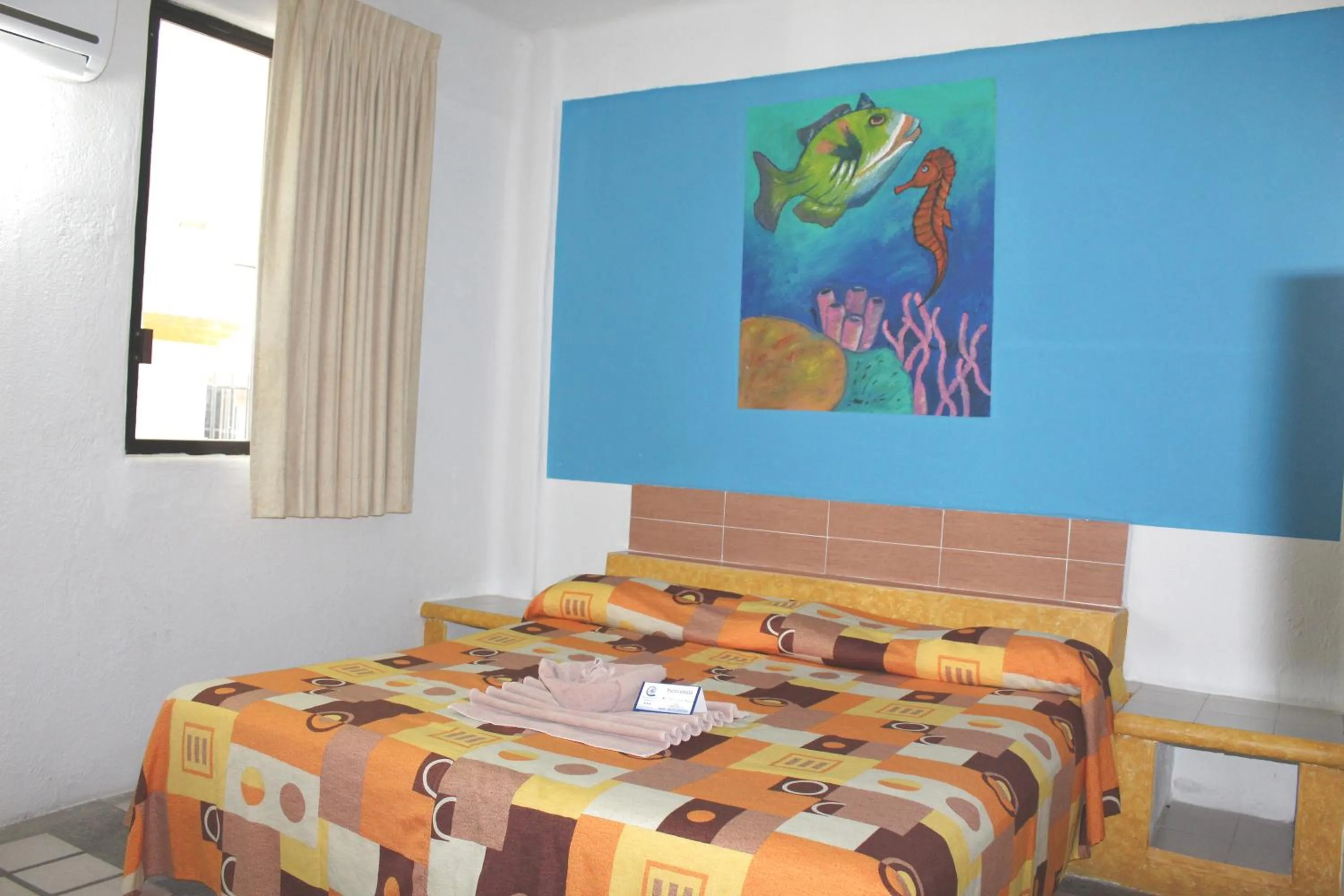 Bed in Hotel Arrecife Huatulco Plus