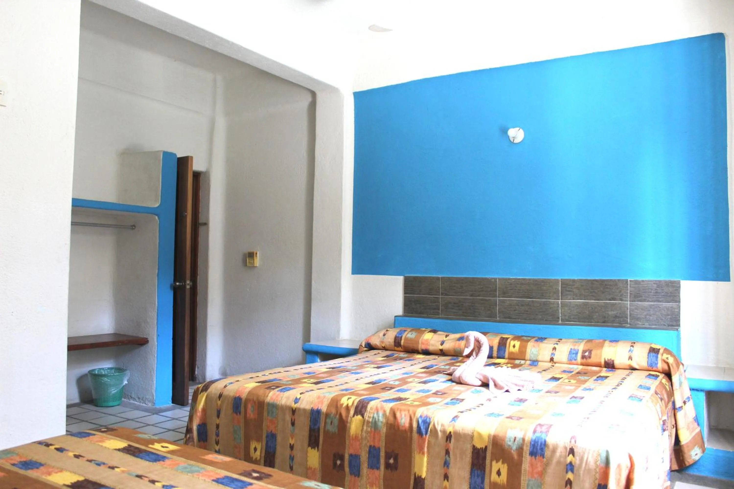 Bed in Hotel Arrecife Huatulco Plus