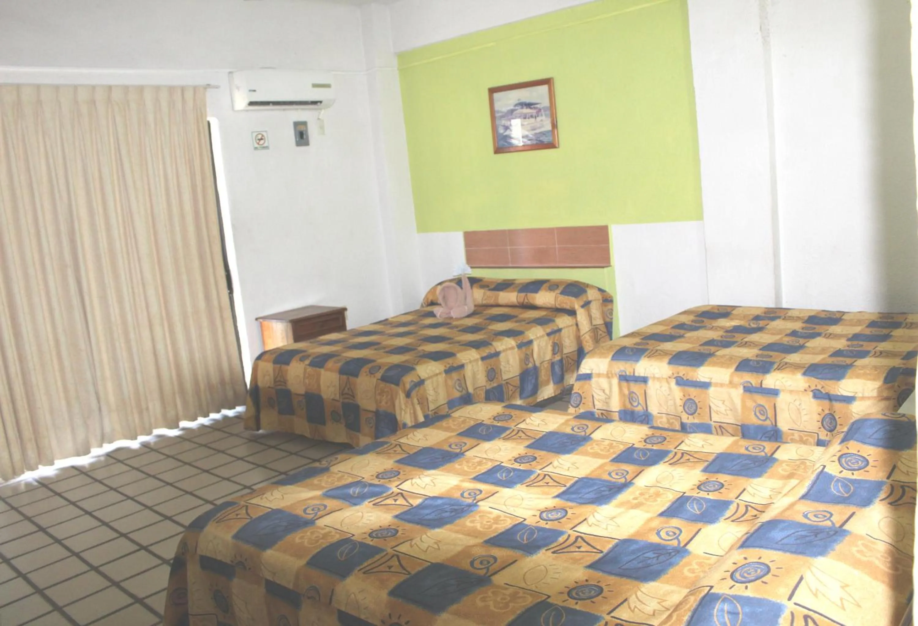 Bed in Hotel Arrecife Huatulco Plus