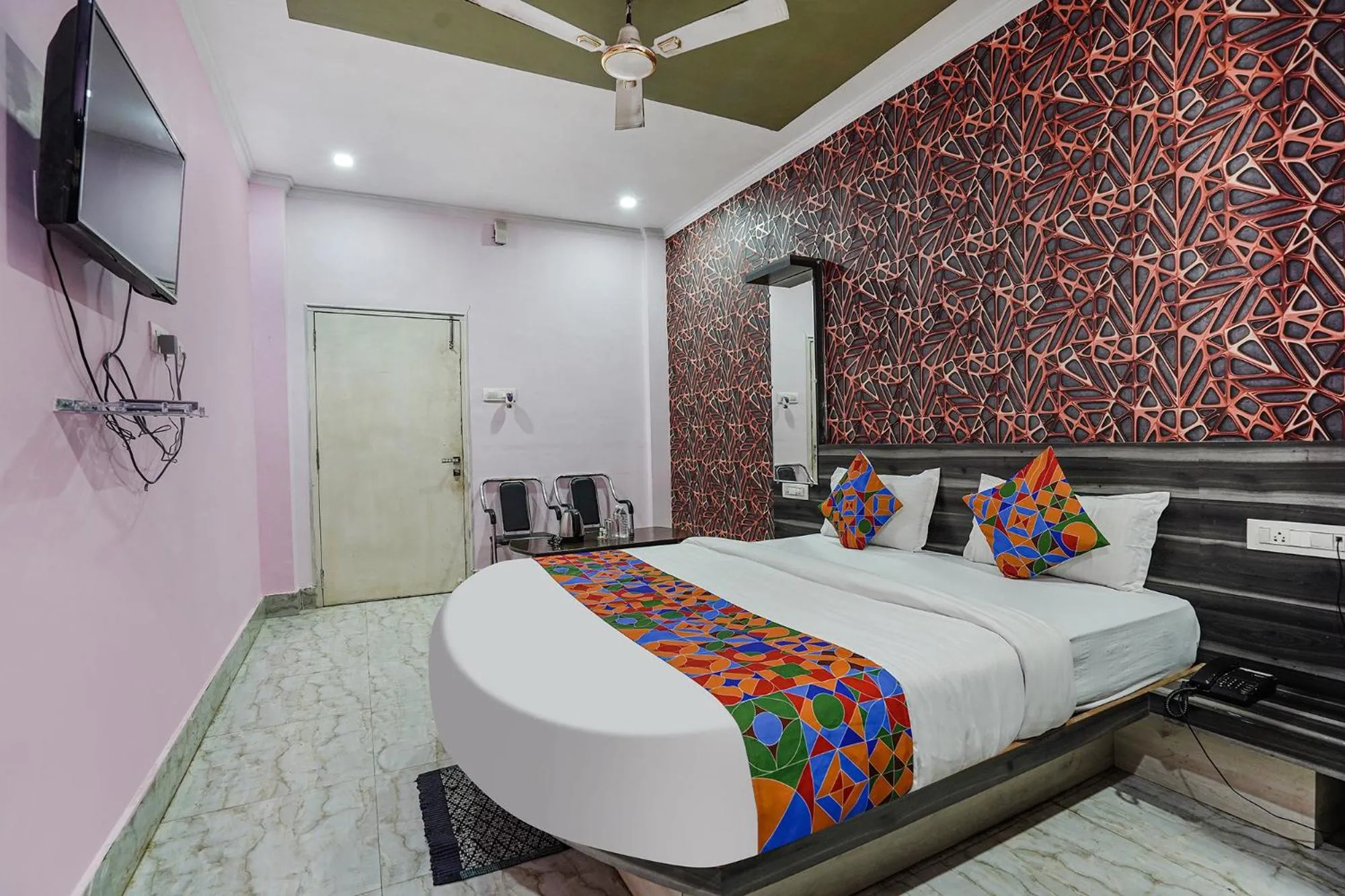 Bed in FabHotel Deepak Palace