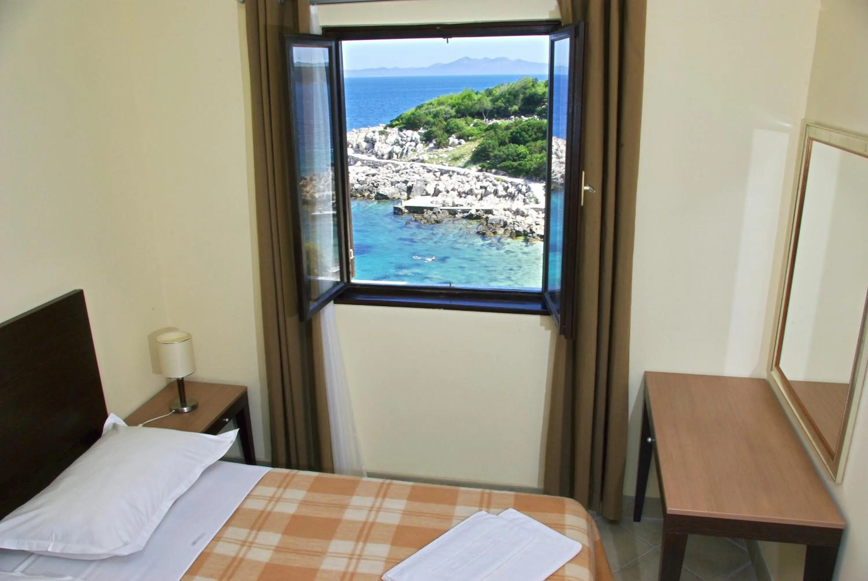 Bed in Hotel Priscapac Resort & Apartments