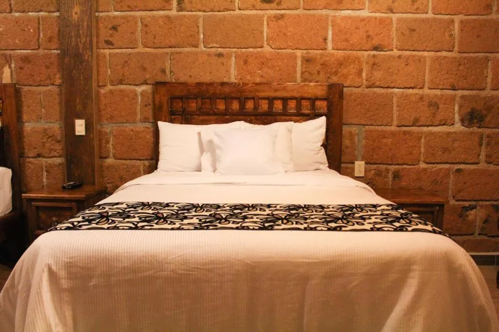 Bed in Hotel Real Nirvana