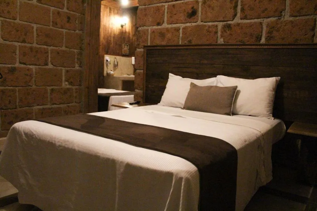 Bed in Hotel Real Nirvana