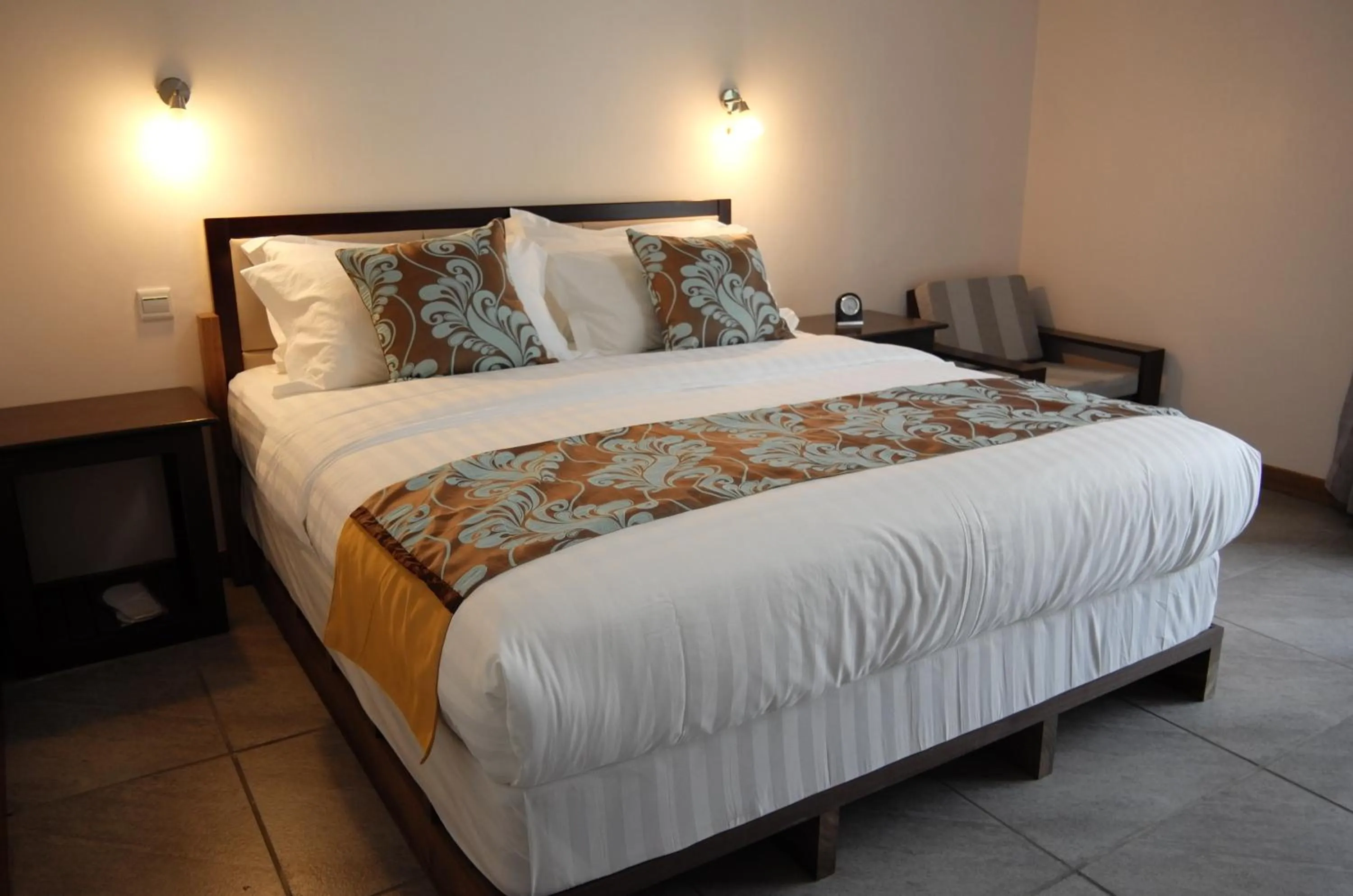 Bed in Luganvilla Business Hotel and Restaurant