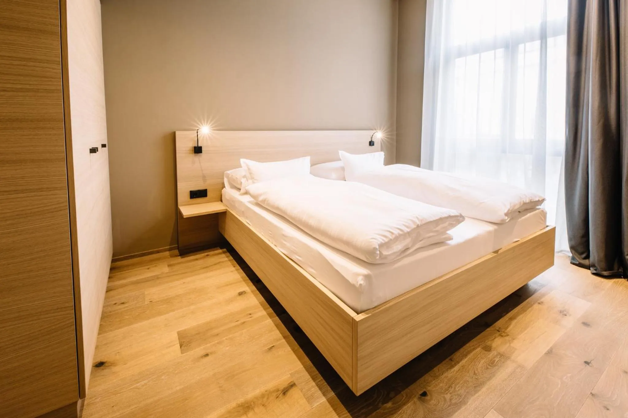Bed in Panoramic Suites Winzerhöhe