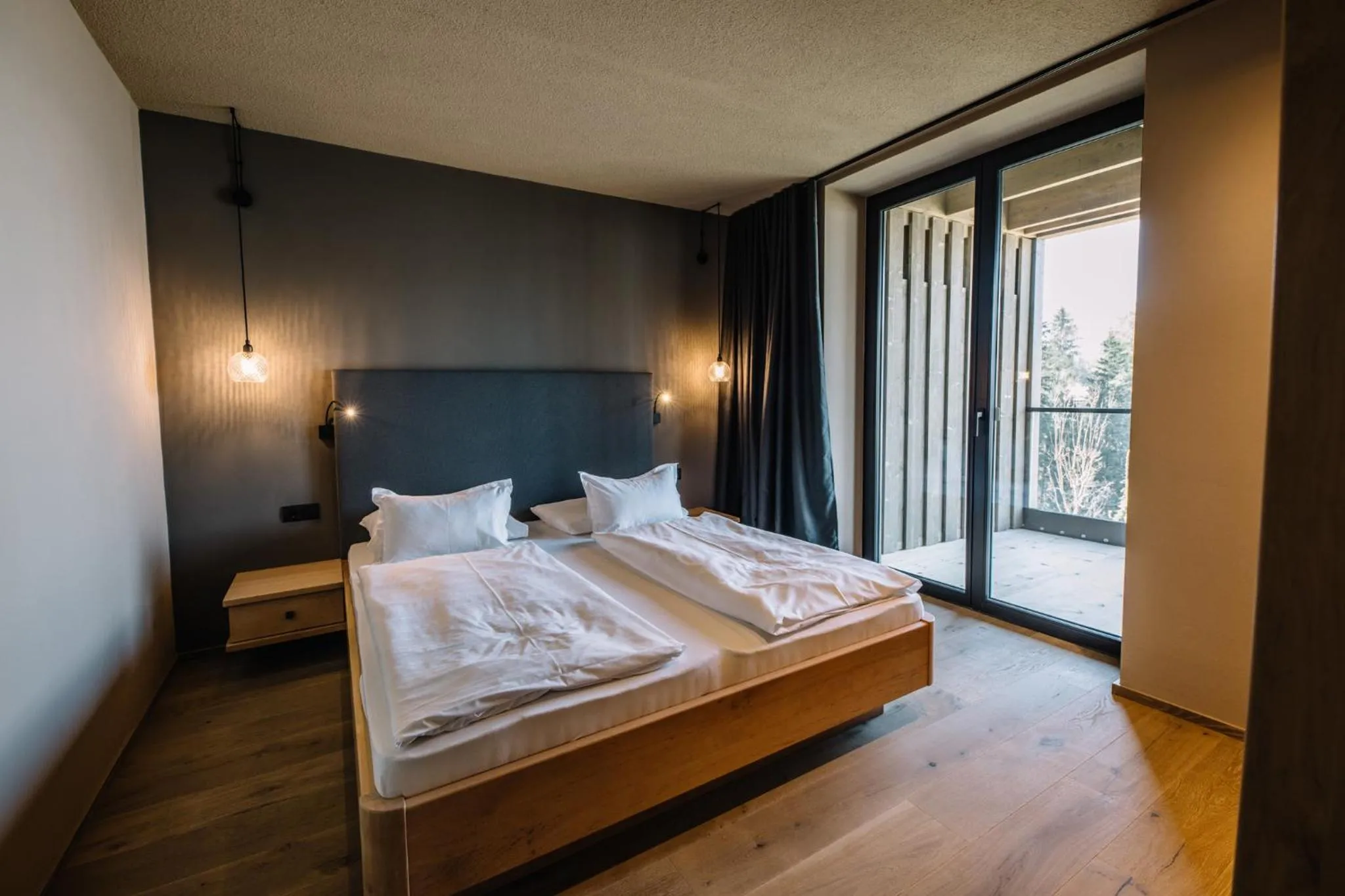 Bed in Panoramic Suites Winzerhöhe