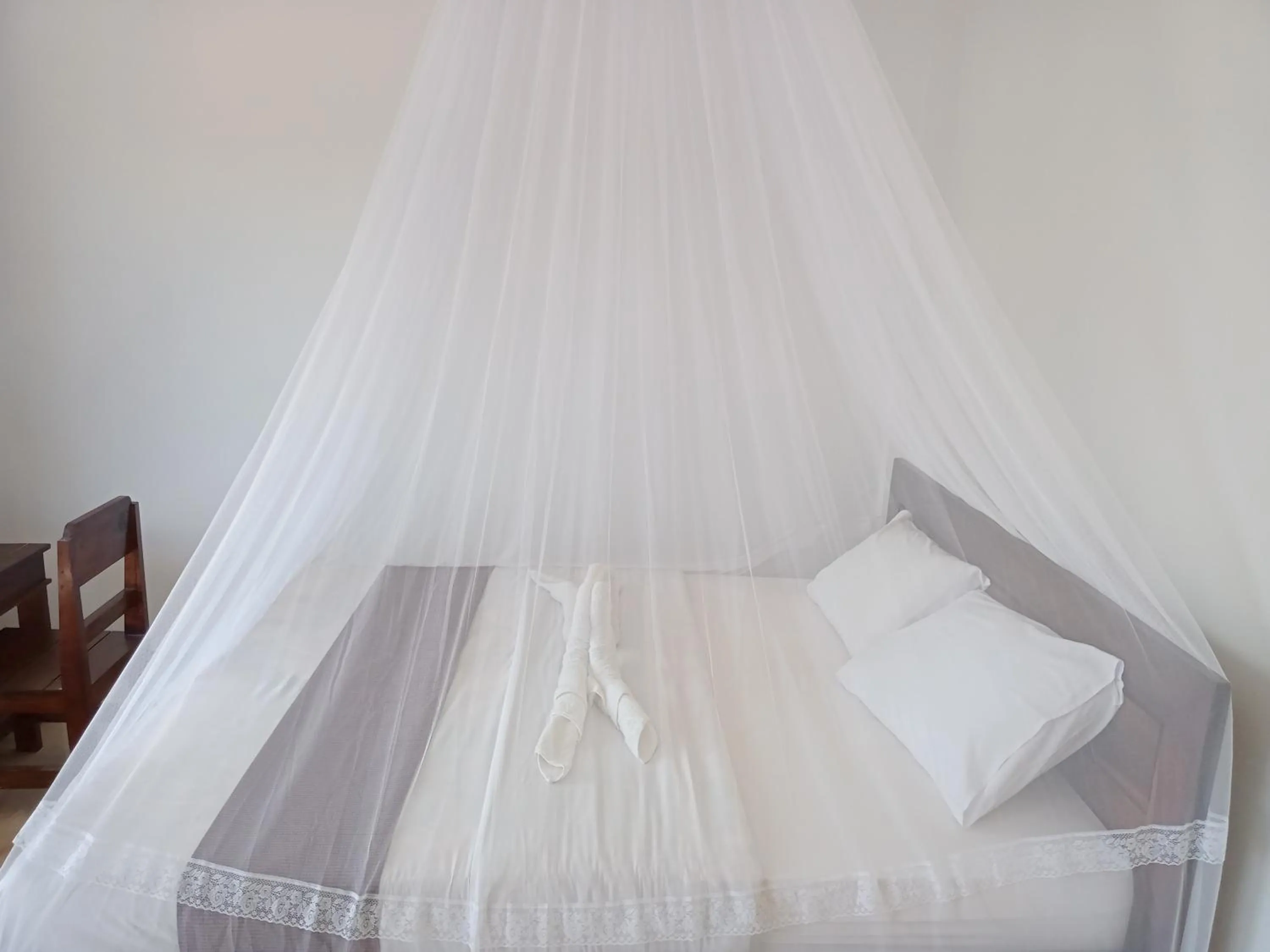 Bed in Aris Homestay and Warung Made