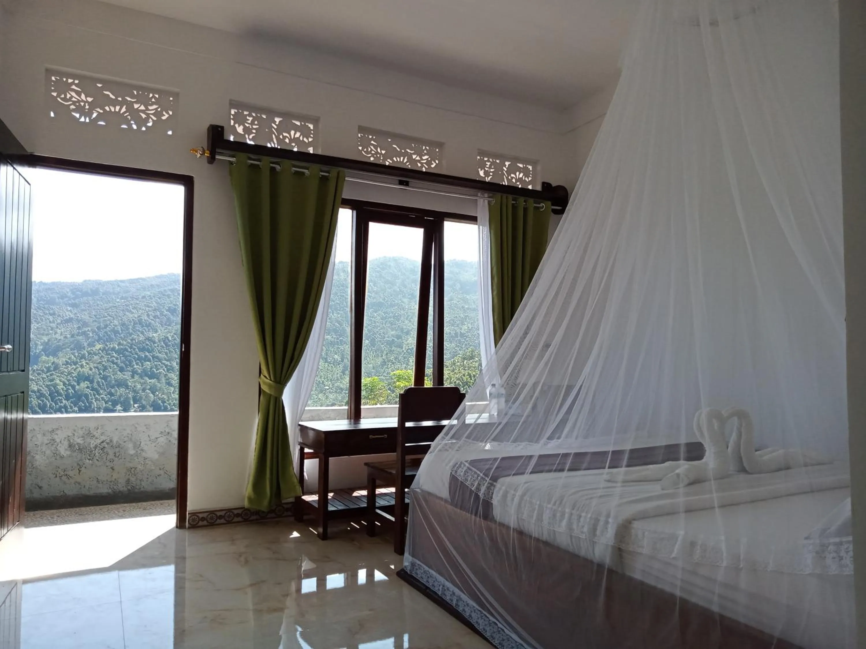 Bed in Aris Homestay and Warung Made