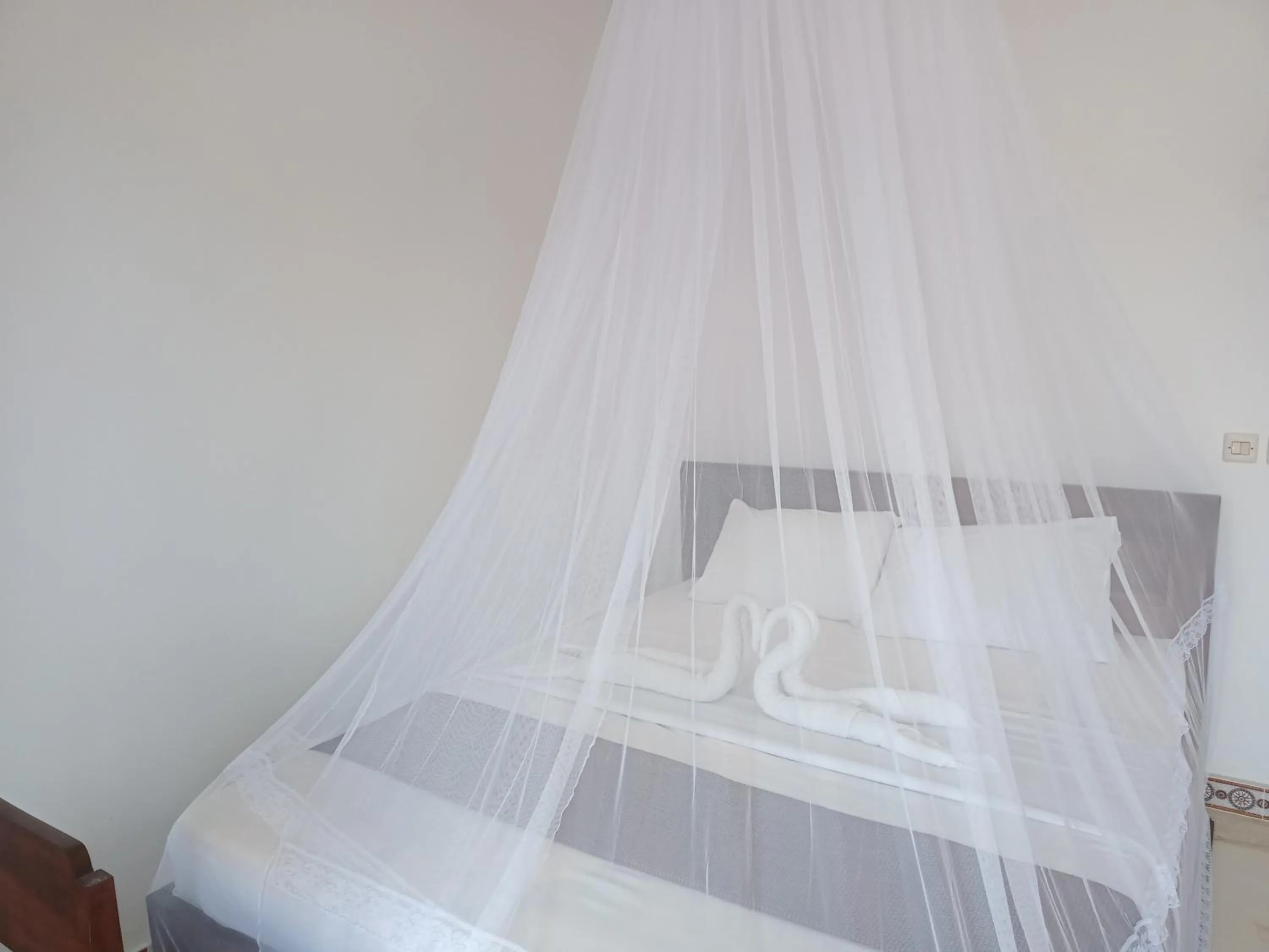 Bed in Aris Homestay and Warung Made