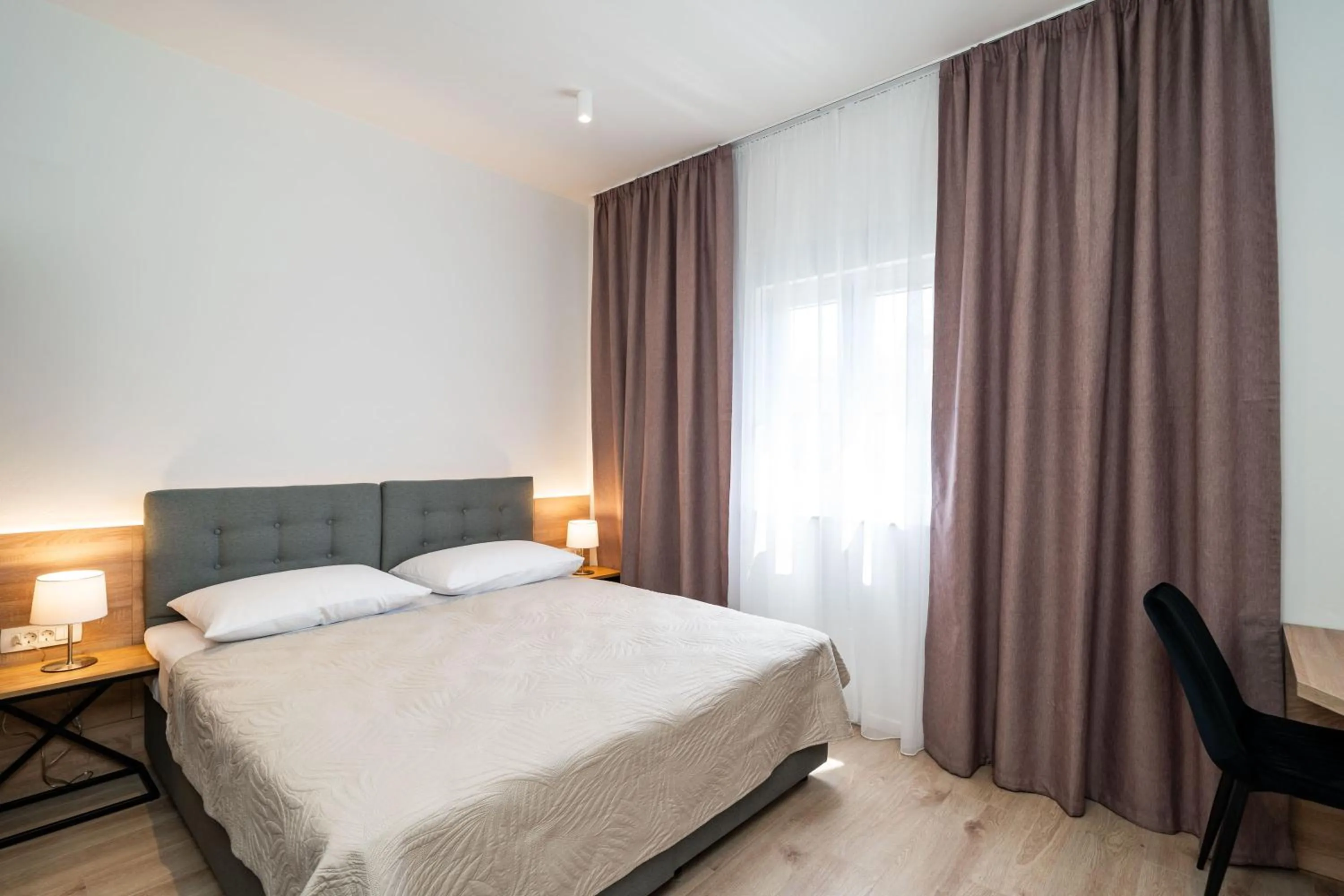 Bed in Bacan Serviced Apartments