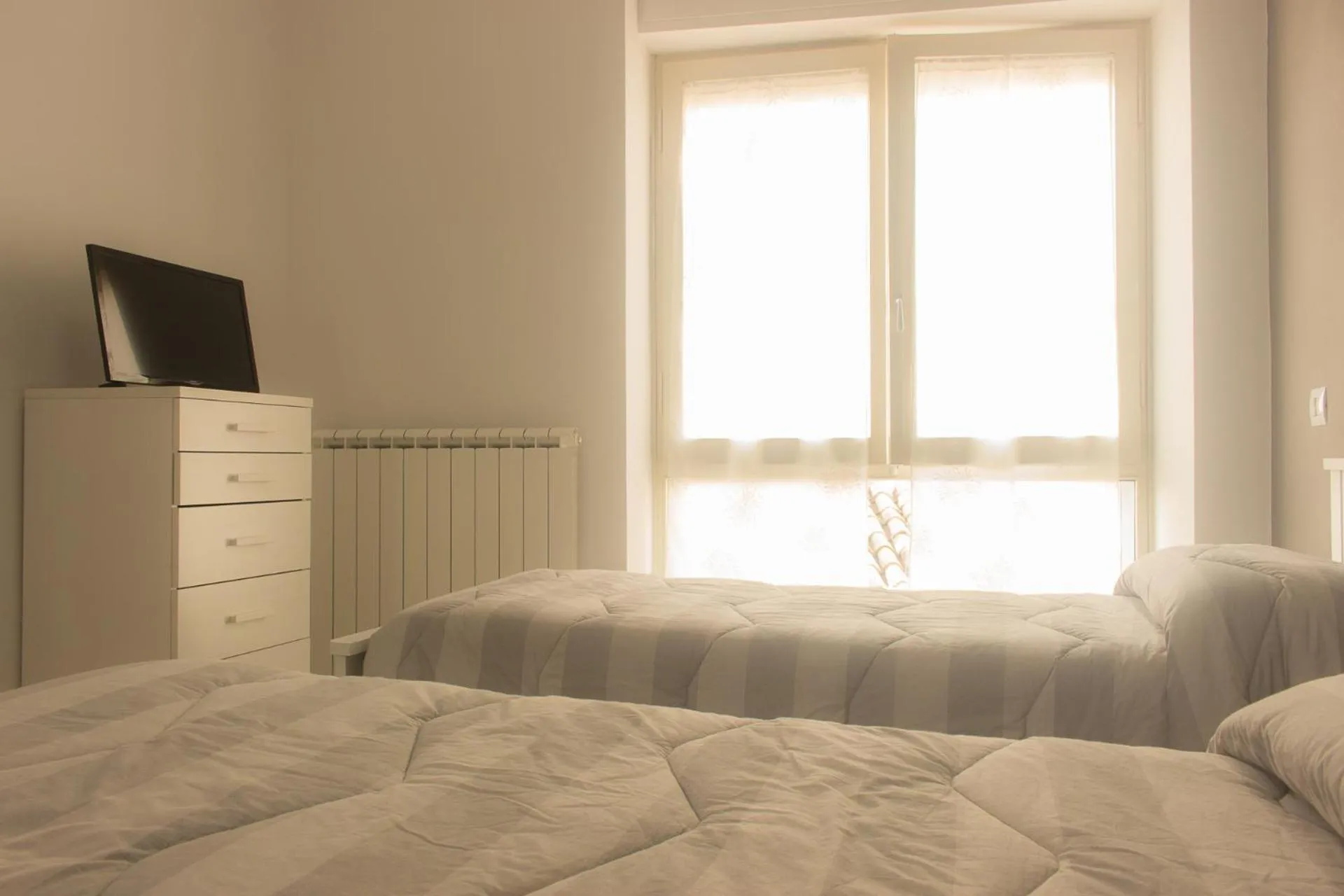 Twin Room with Shared Bathroom - single occupancy in Casa Roncalli