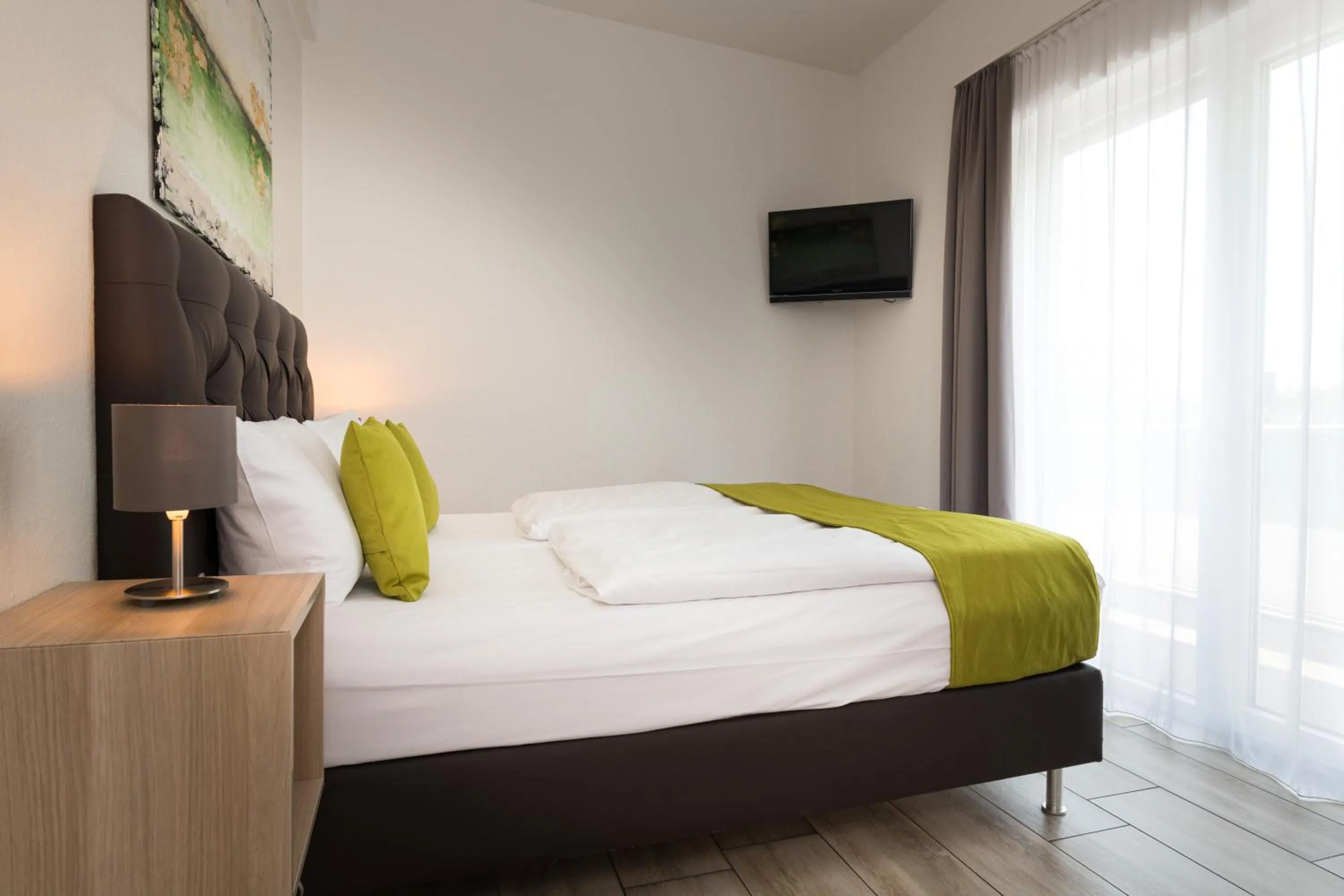 Bedroom, Bed in GLEUEL INN - digital hotel & serviced apartments & boardinghouse mit voll ausgestatteten Küchen