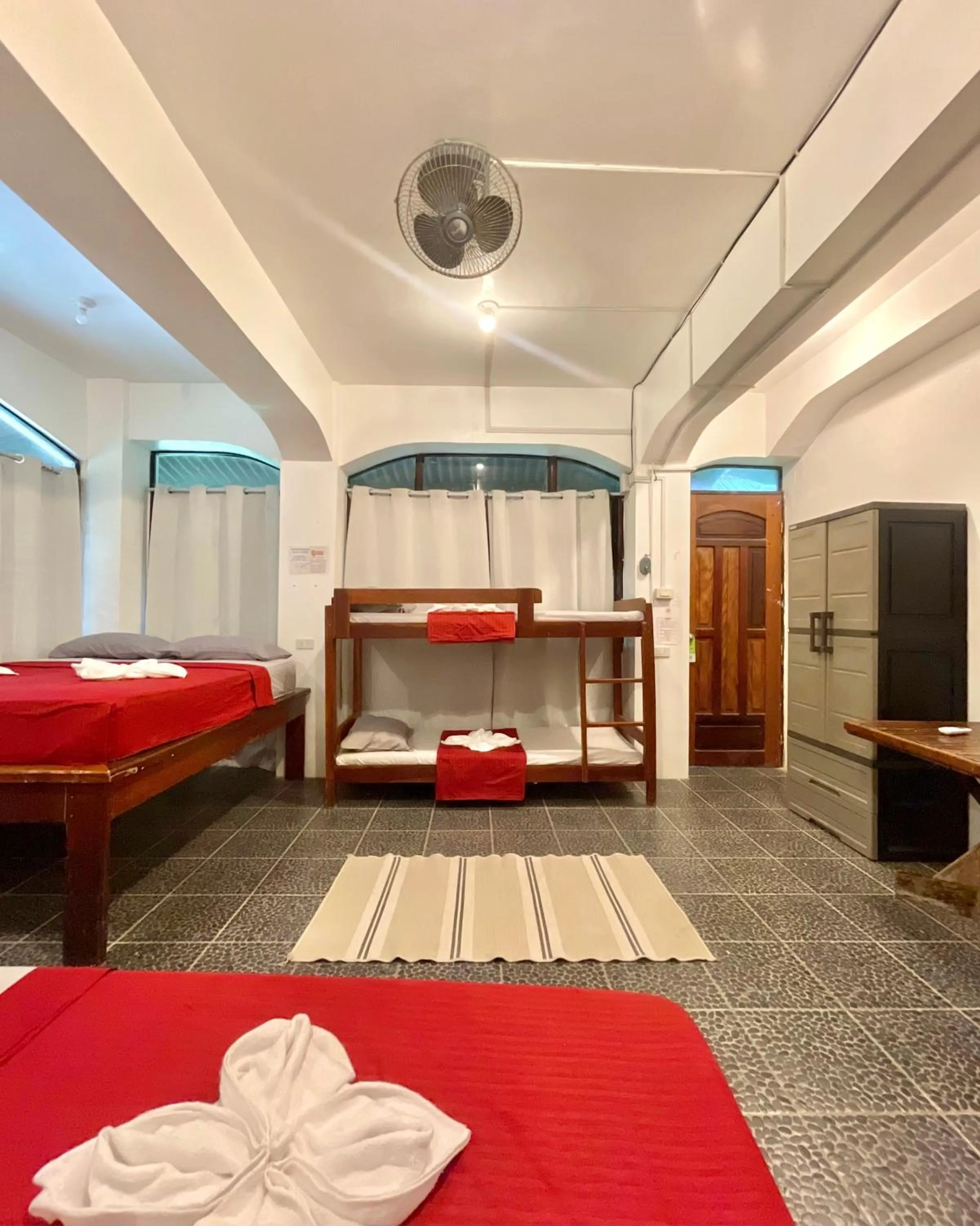 Bed in Patrick's on the Beach Resort