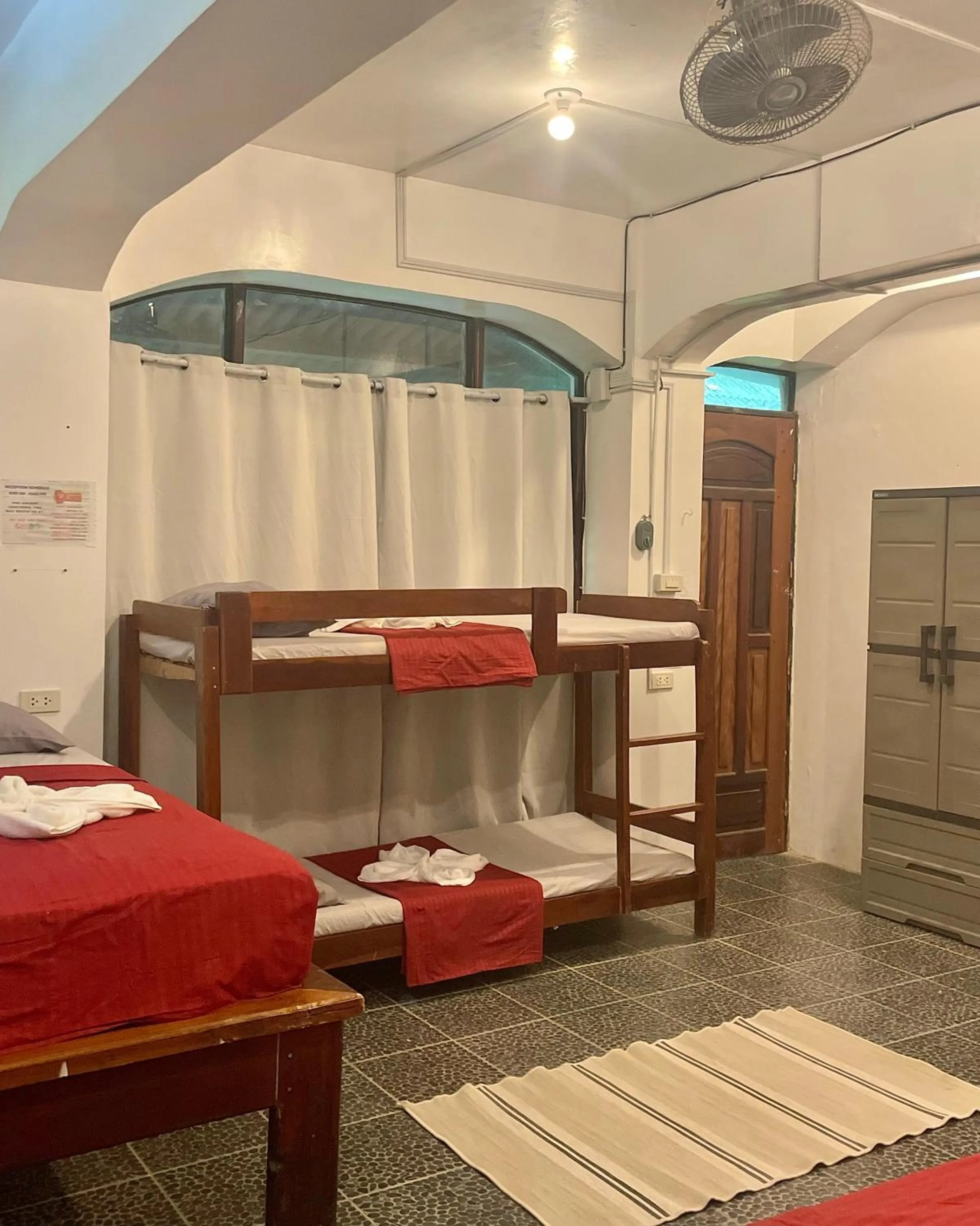 Bed in Patrick's on the Beach Resort