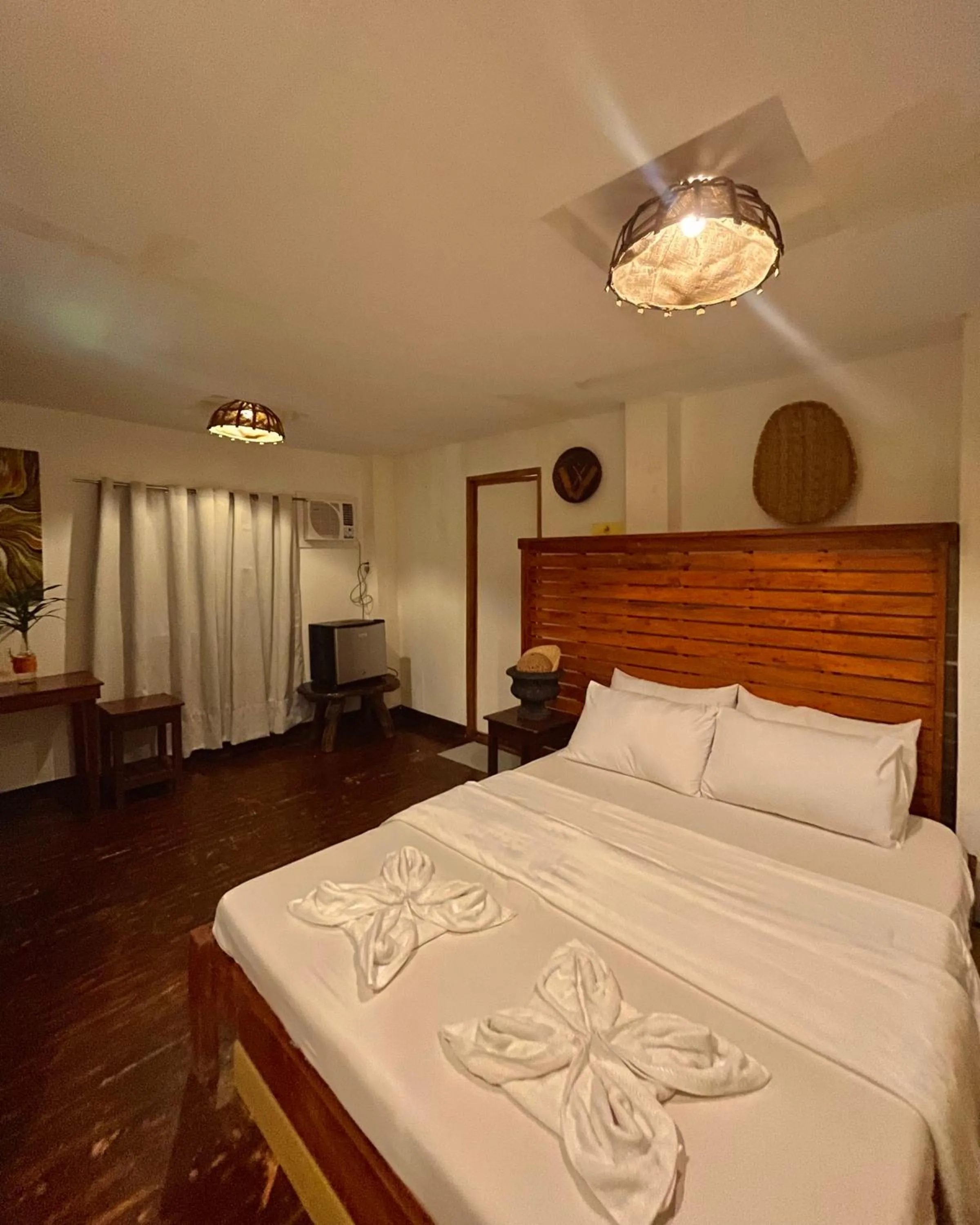 Bed in Patrick's on the Beach Resort