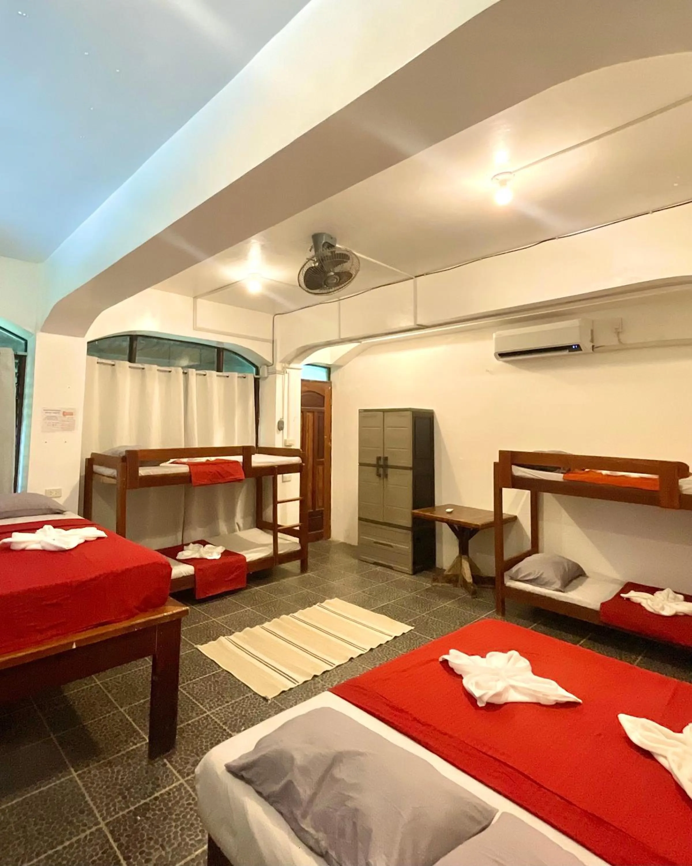 Bed in Patrick's on the Beach Resort