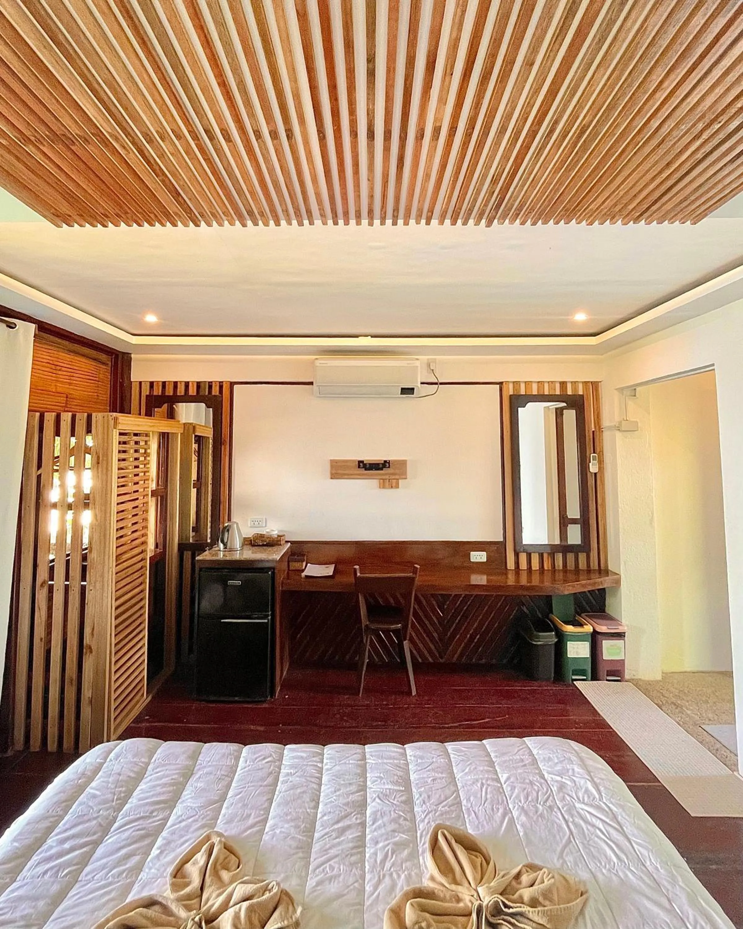 Bed in Patrick's on the Beach Resort