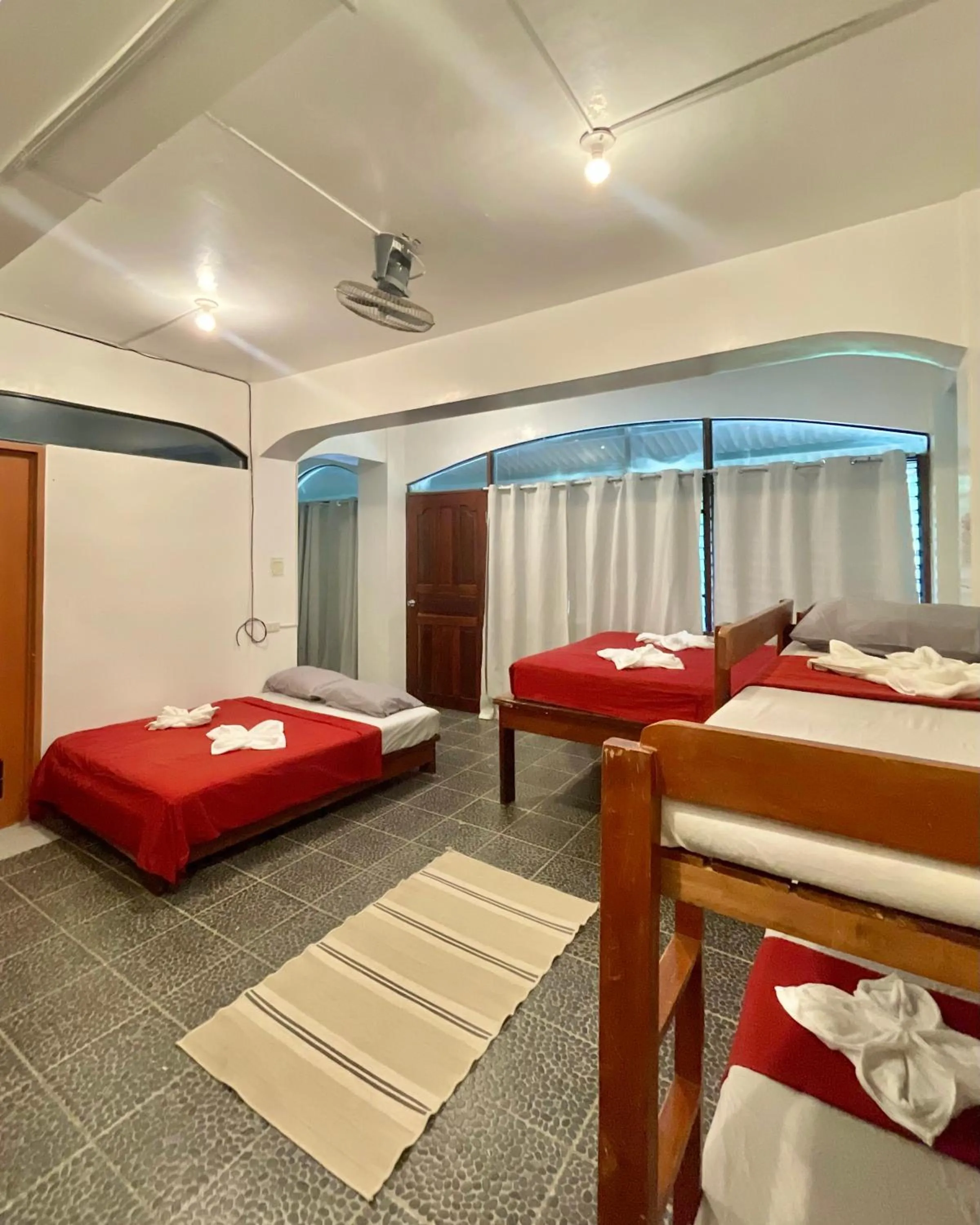 Bed in Patrick's on the Beach Resort