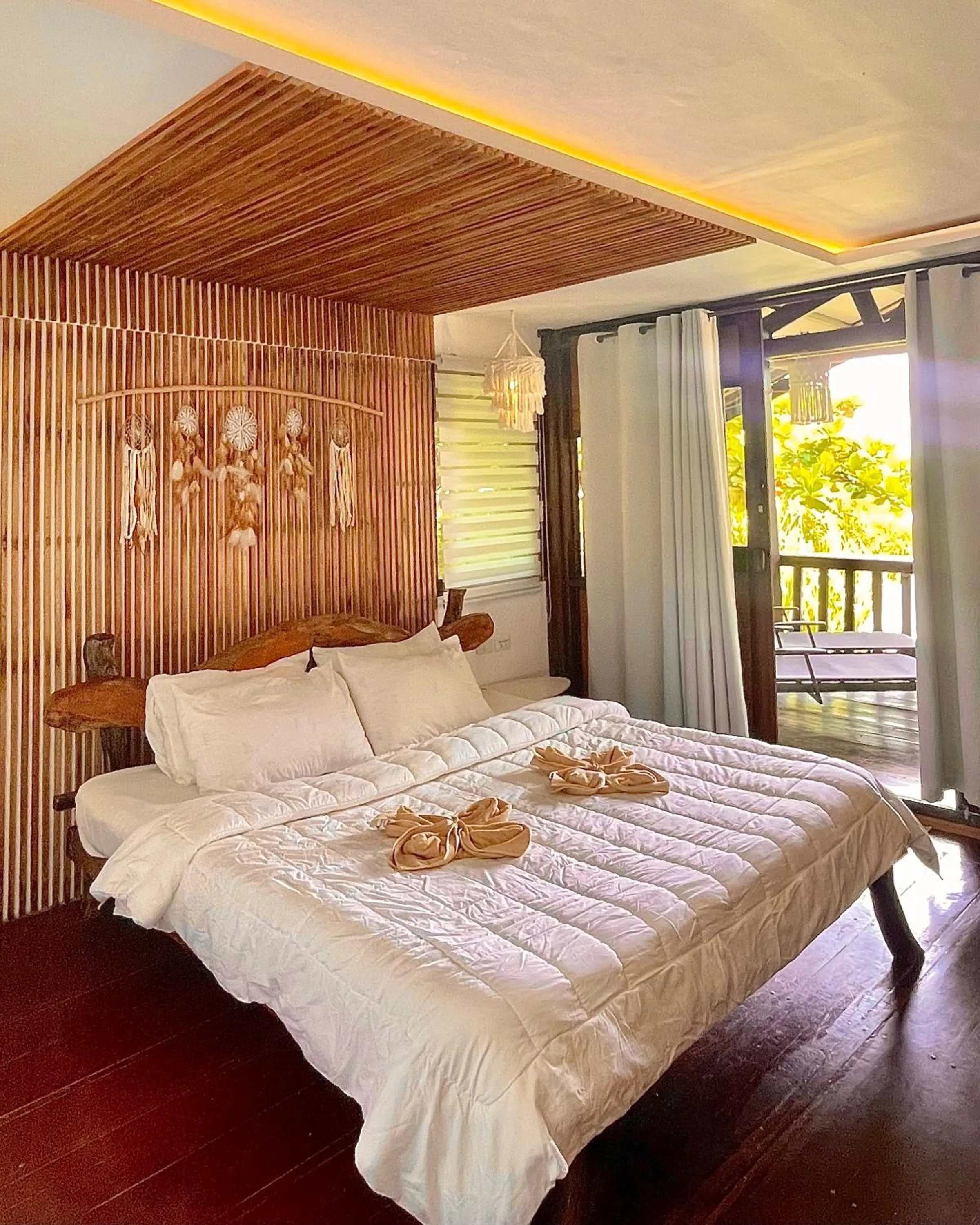 Bed in Patrick's on the Beach Resort