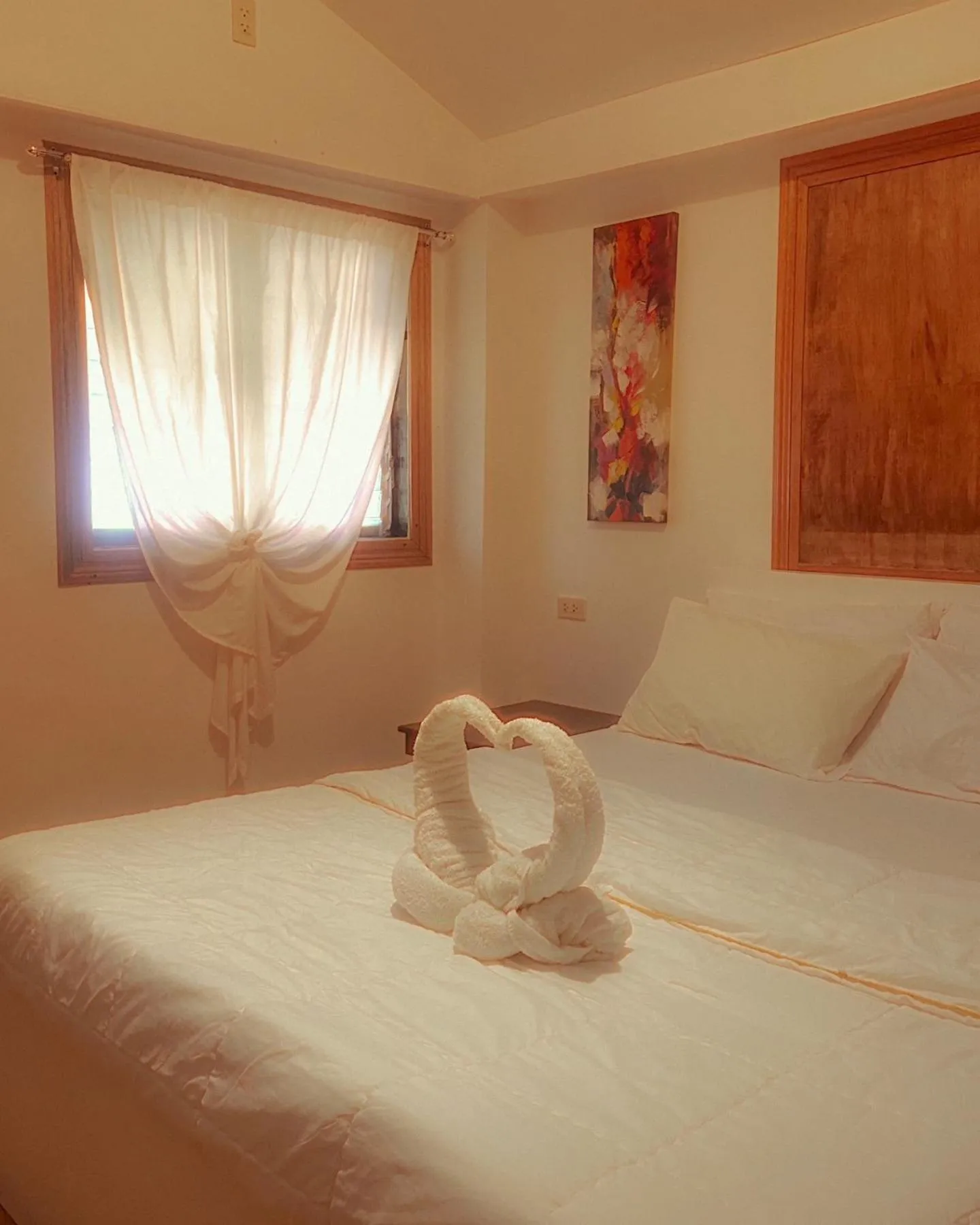 Bed in Patrick's on the Beach Resort