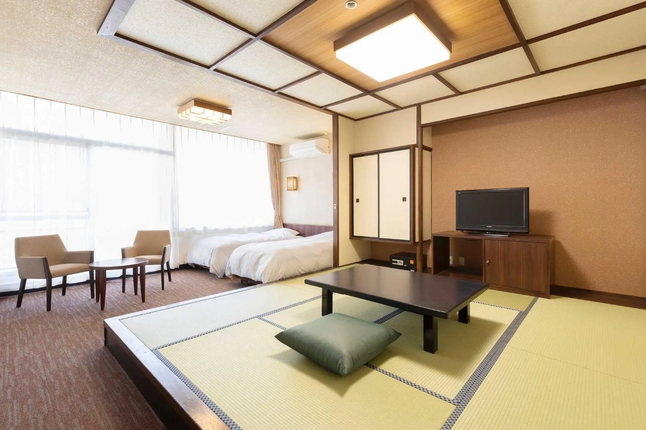 Bed in Ooedo Onsen Monogatari Premium Hotel New Shiobara