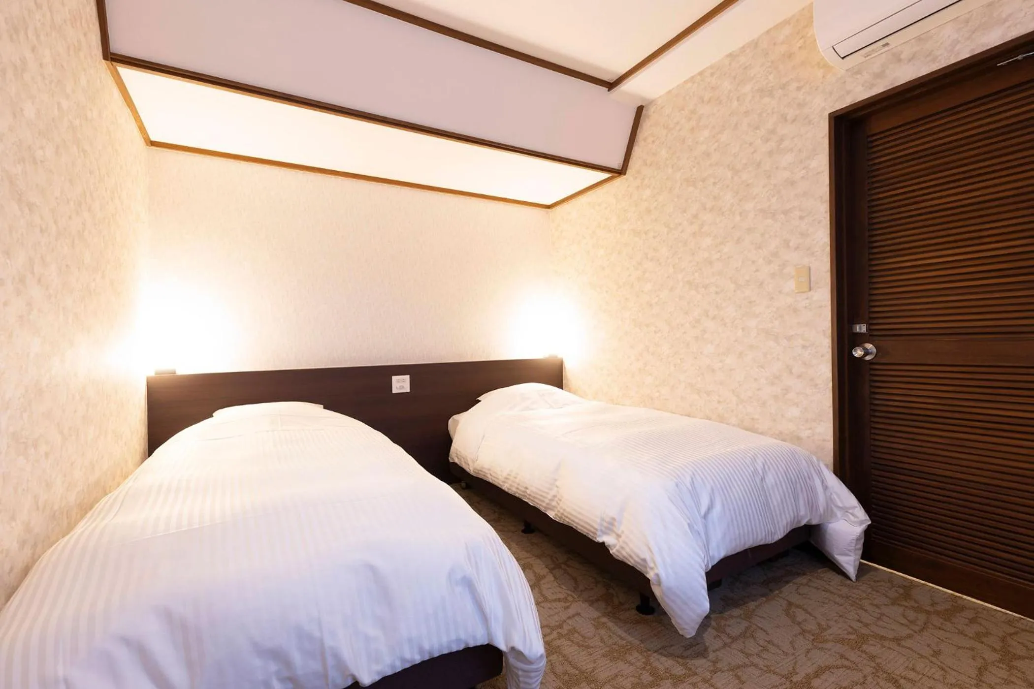 Bed in Ooedo Onsen Monogatari Premium Hotel New Shiobara