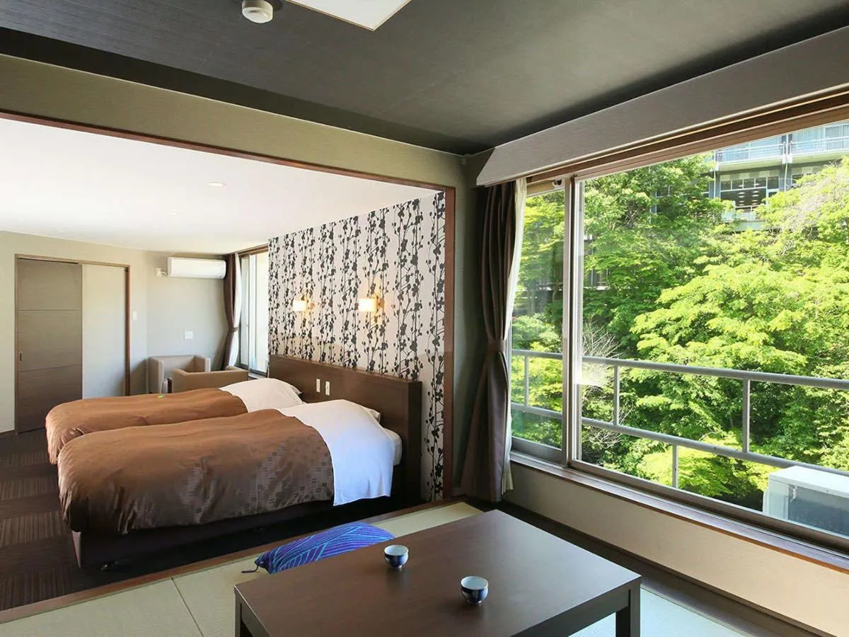 Bed in Ooedo Onsen Monogatari Premium Hotel New Shiobara