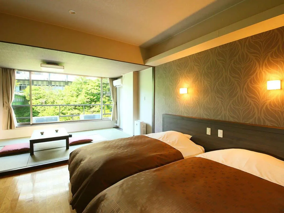 Bed in Ooedo Onsen Monogatari Premium Hotel New Shiobara