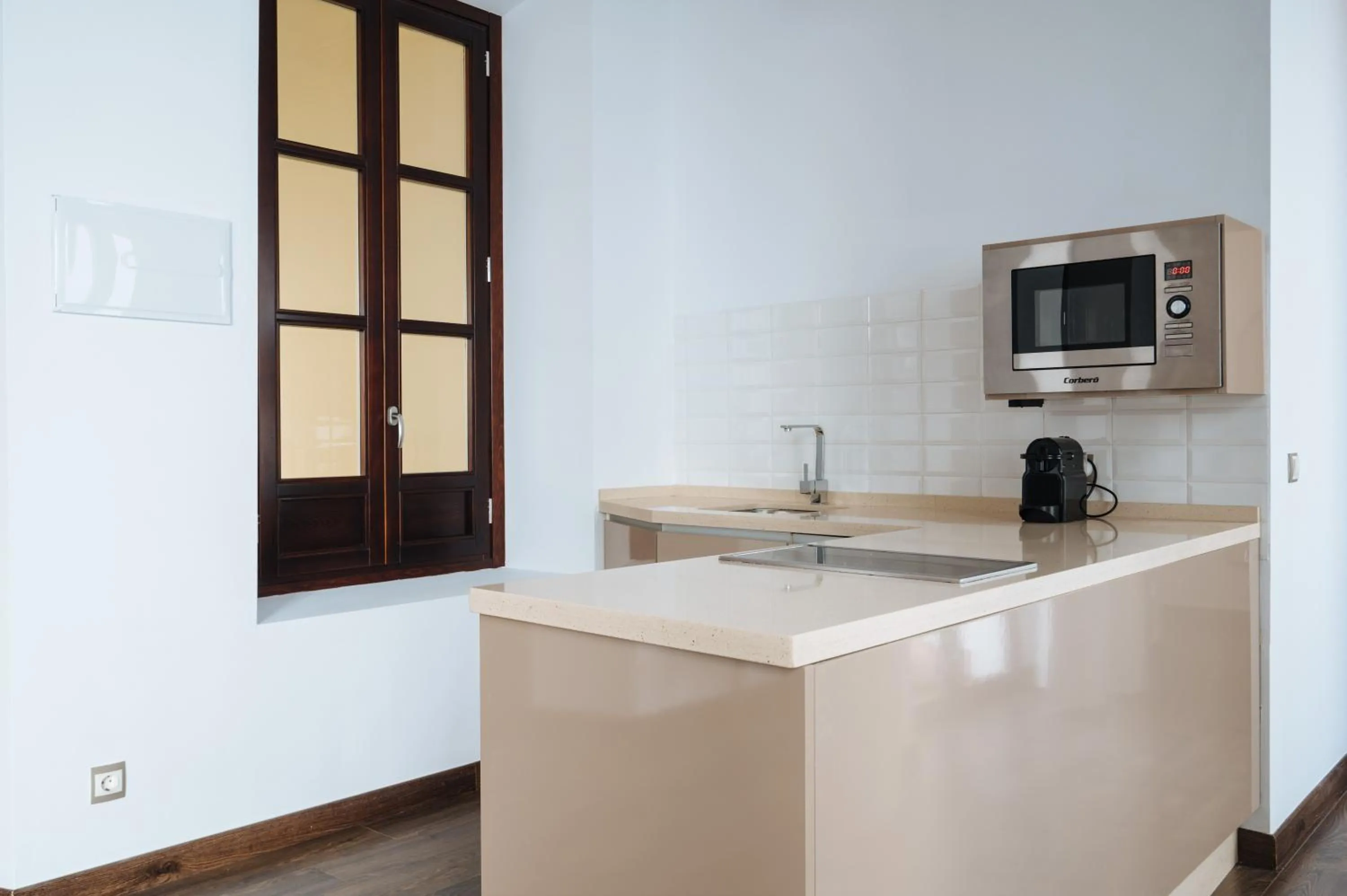 Kitchen or kitchenette in Apartamentos "El Escondite de María"