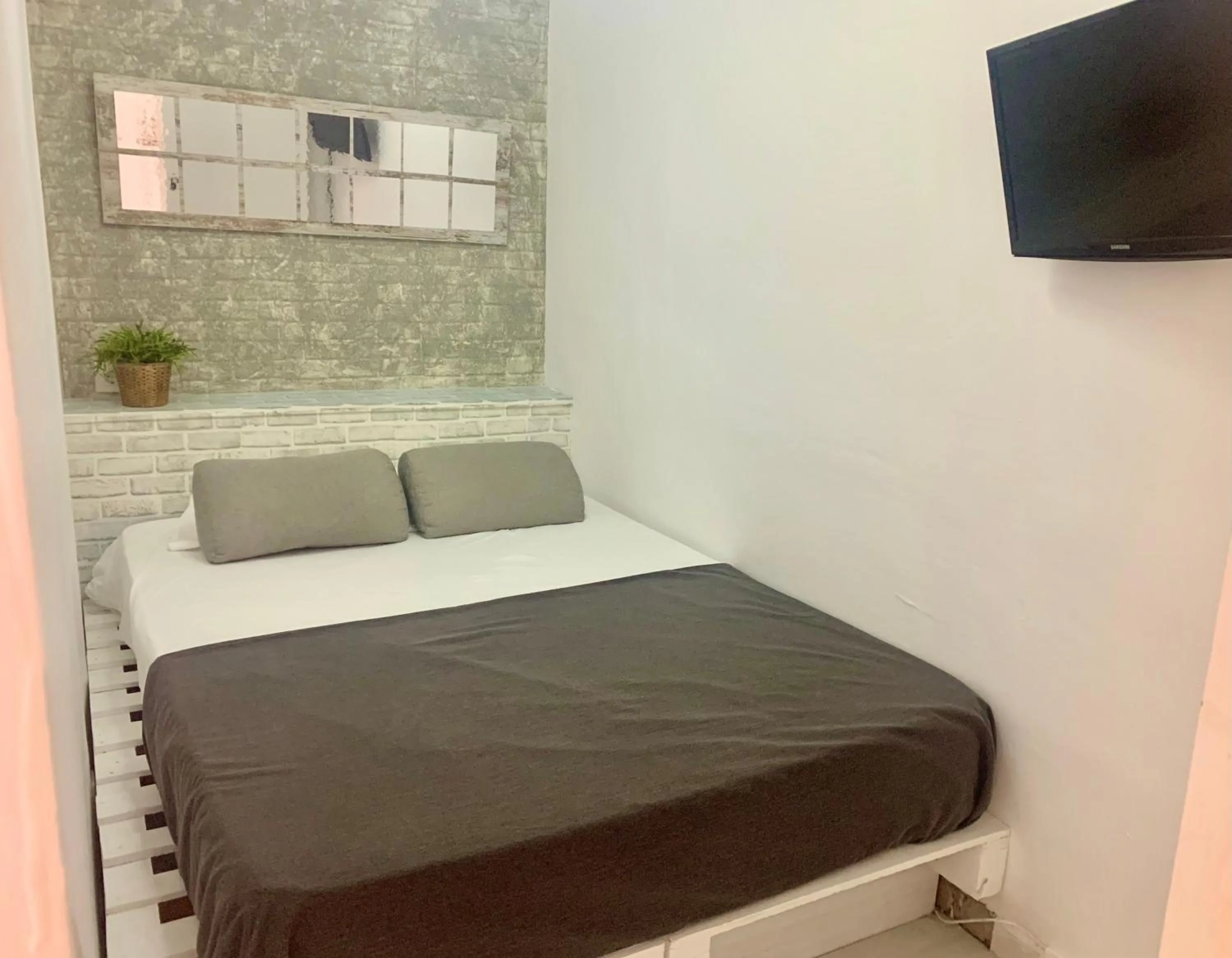 Bed in Panoramic Apartments Sitges