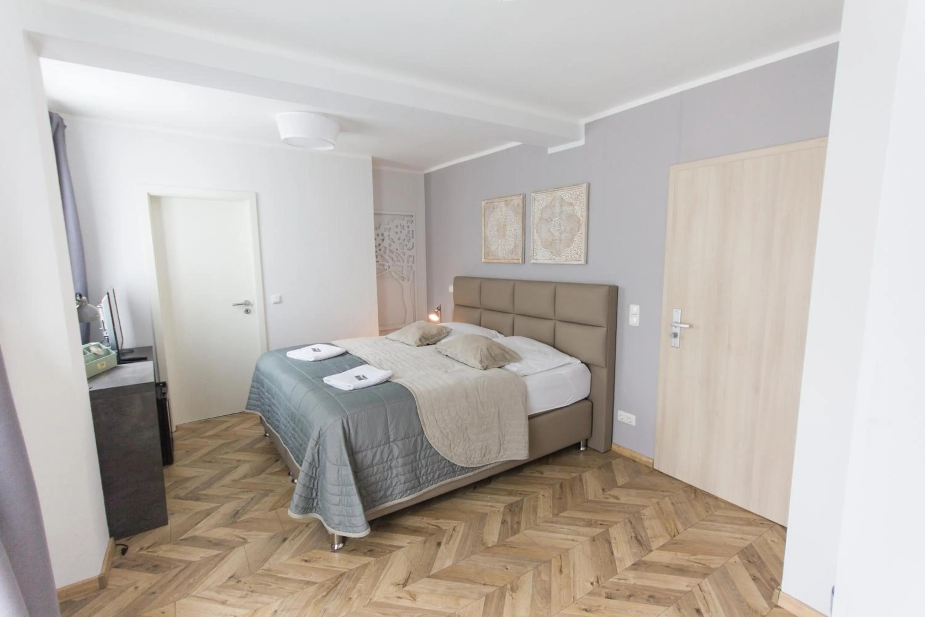 Photo of the whole room, Bed in TM Suites