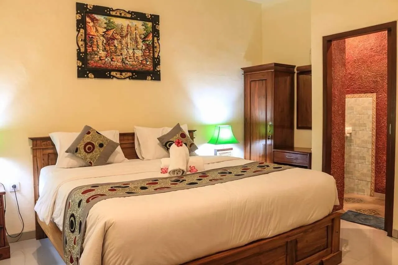 Bed in Reynold Artha Guest House