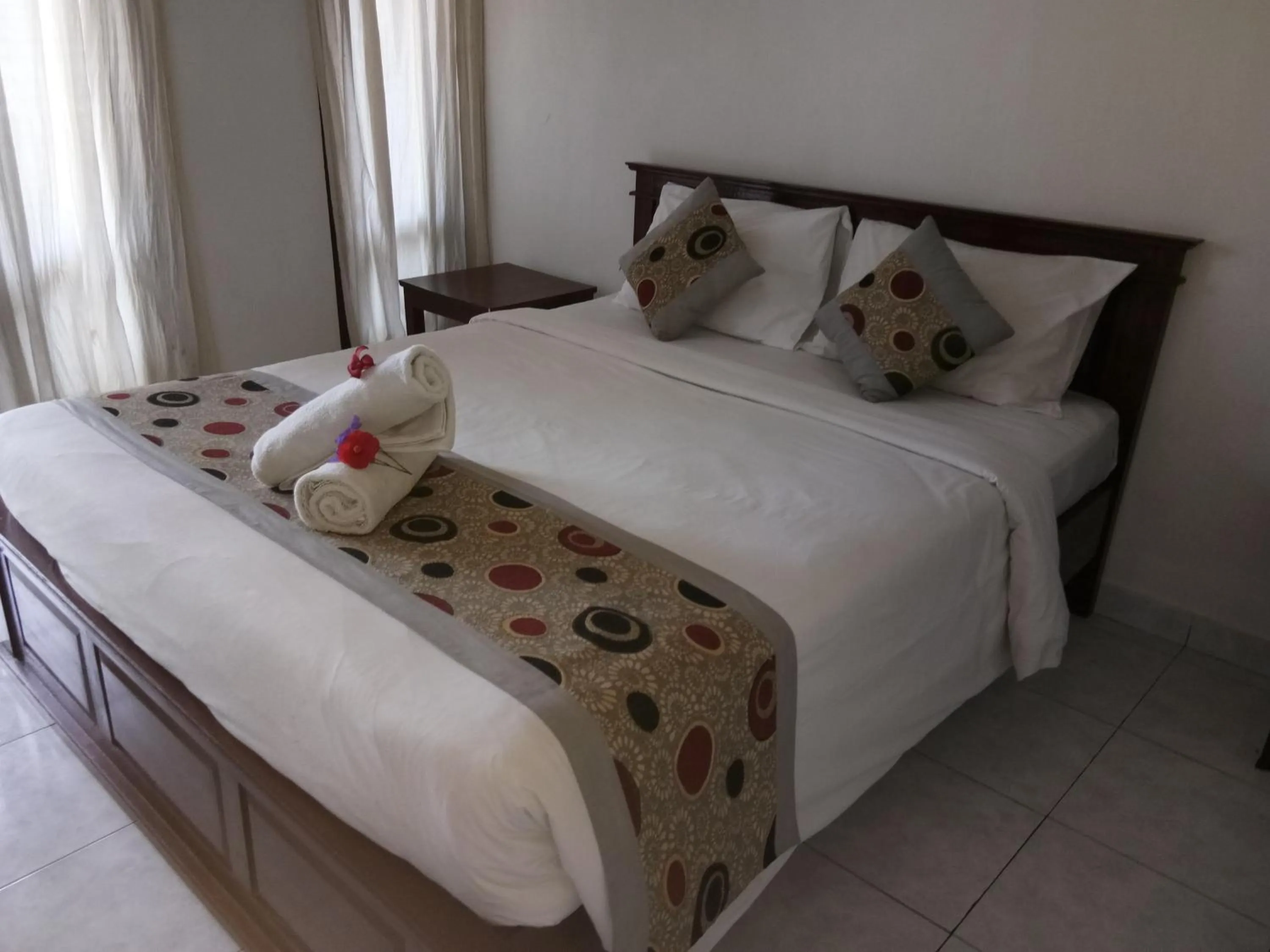 Bed in Reynold Artha Guest House
