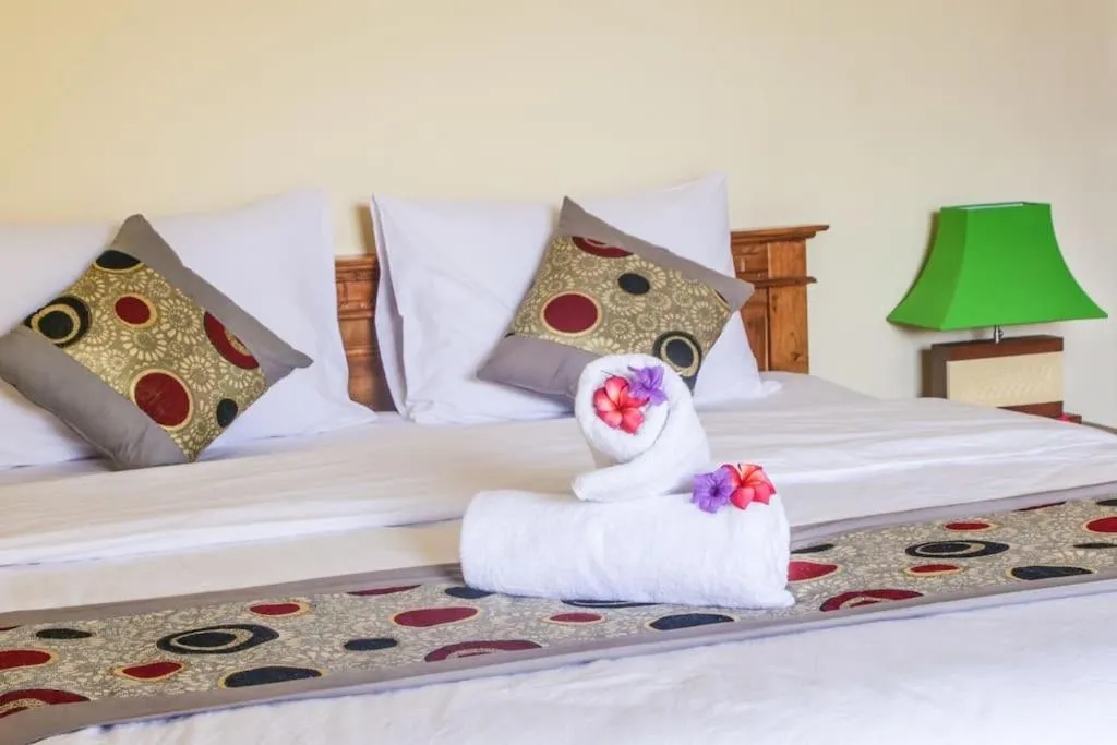 Bed in Reynold Artha Guest House