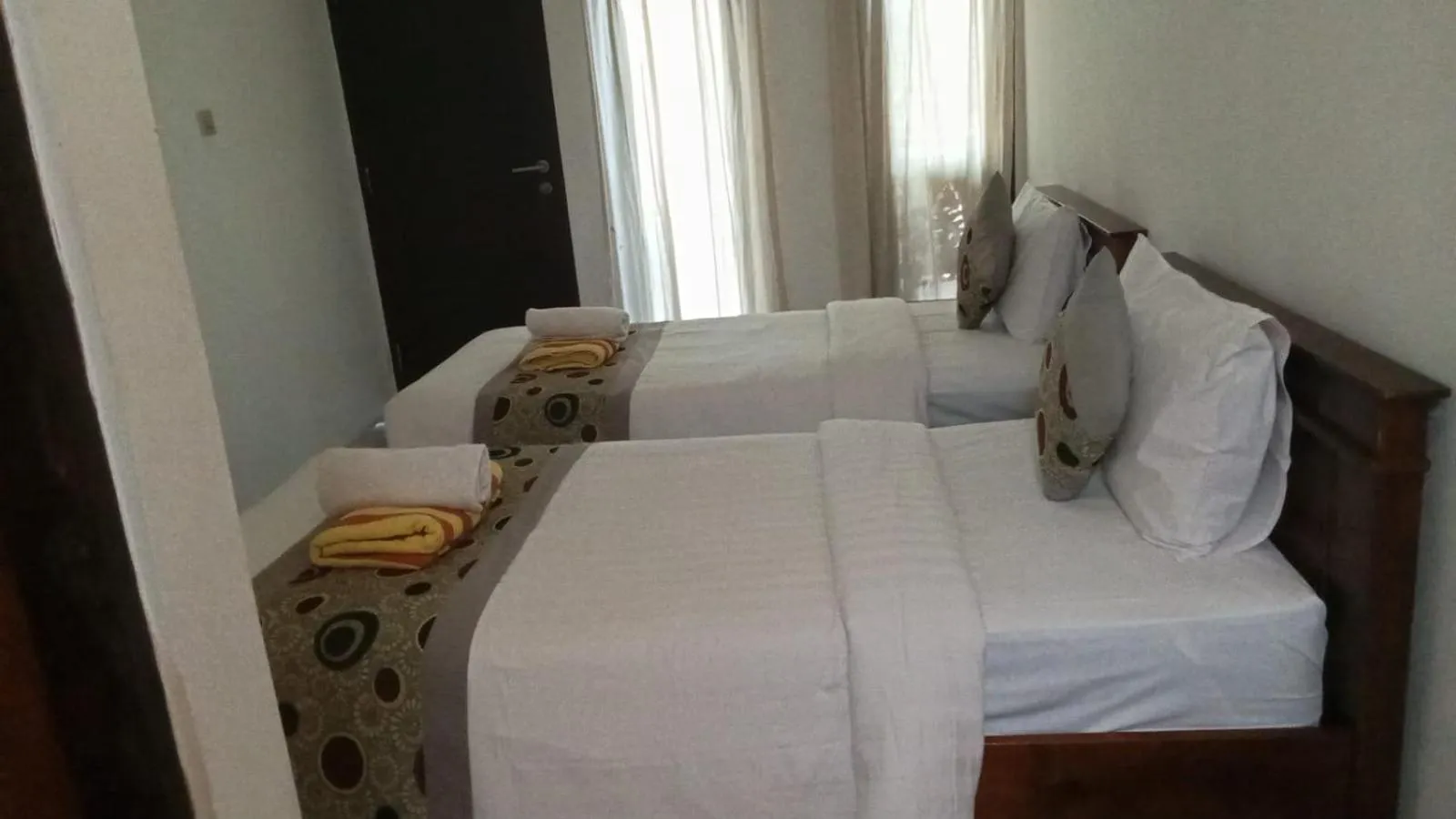 Bed in Reynold Artha Guest House