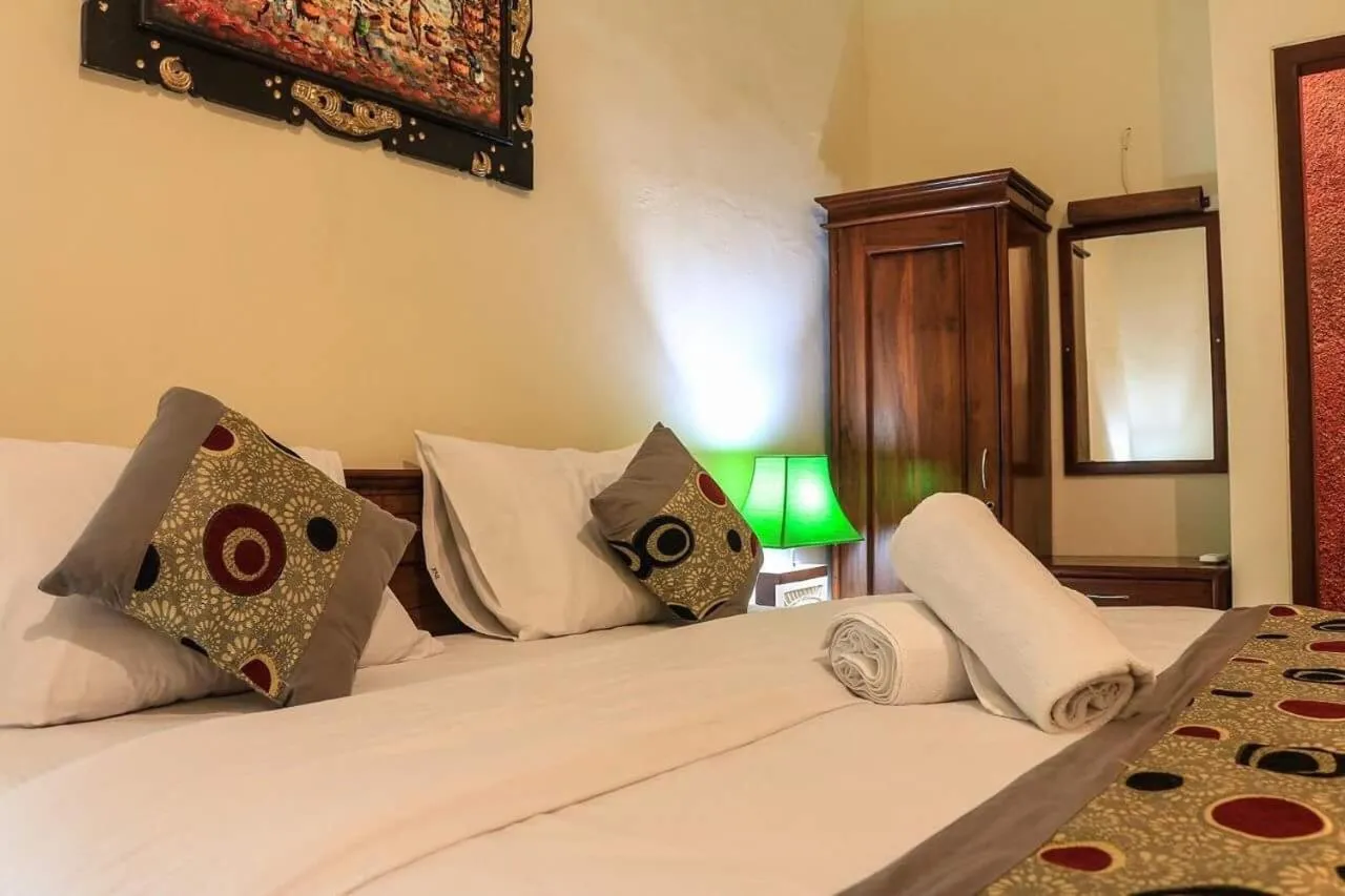 Bed in Reynold Artha Guest House