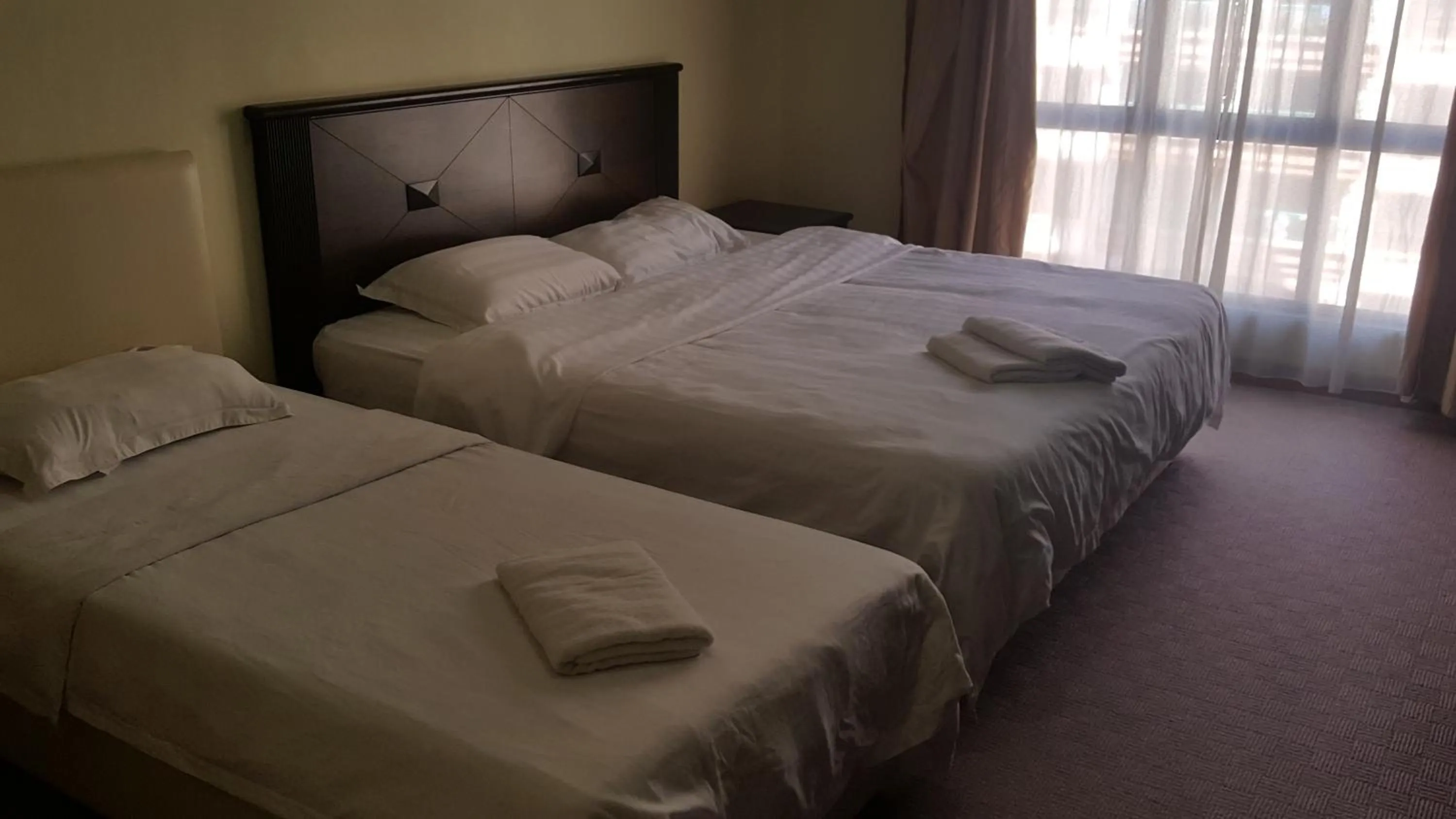 Bed in Homestay Marina Court Resort