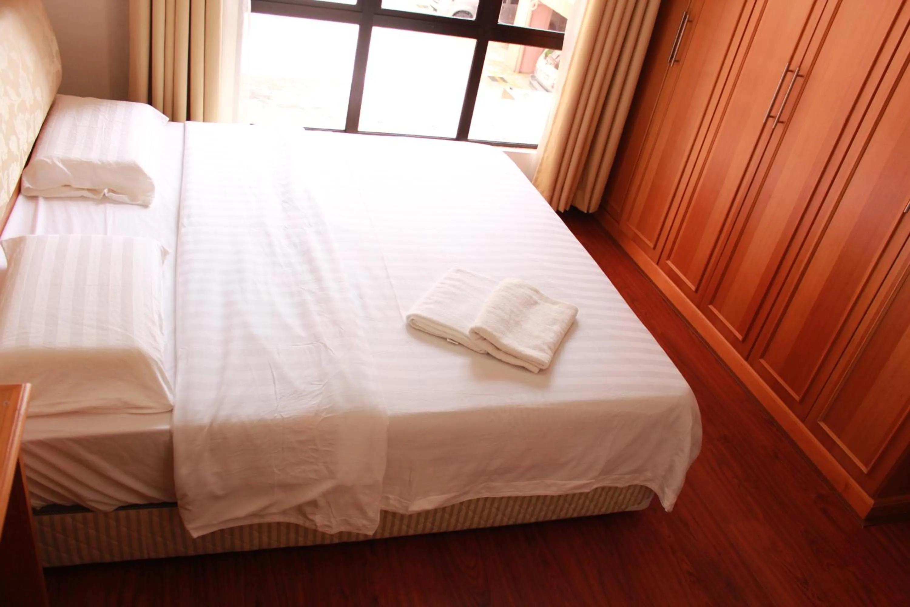 Bedroom, Bed in Homestay Marina Court Resort