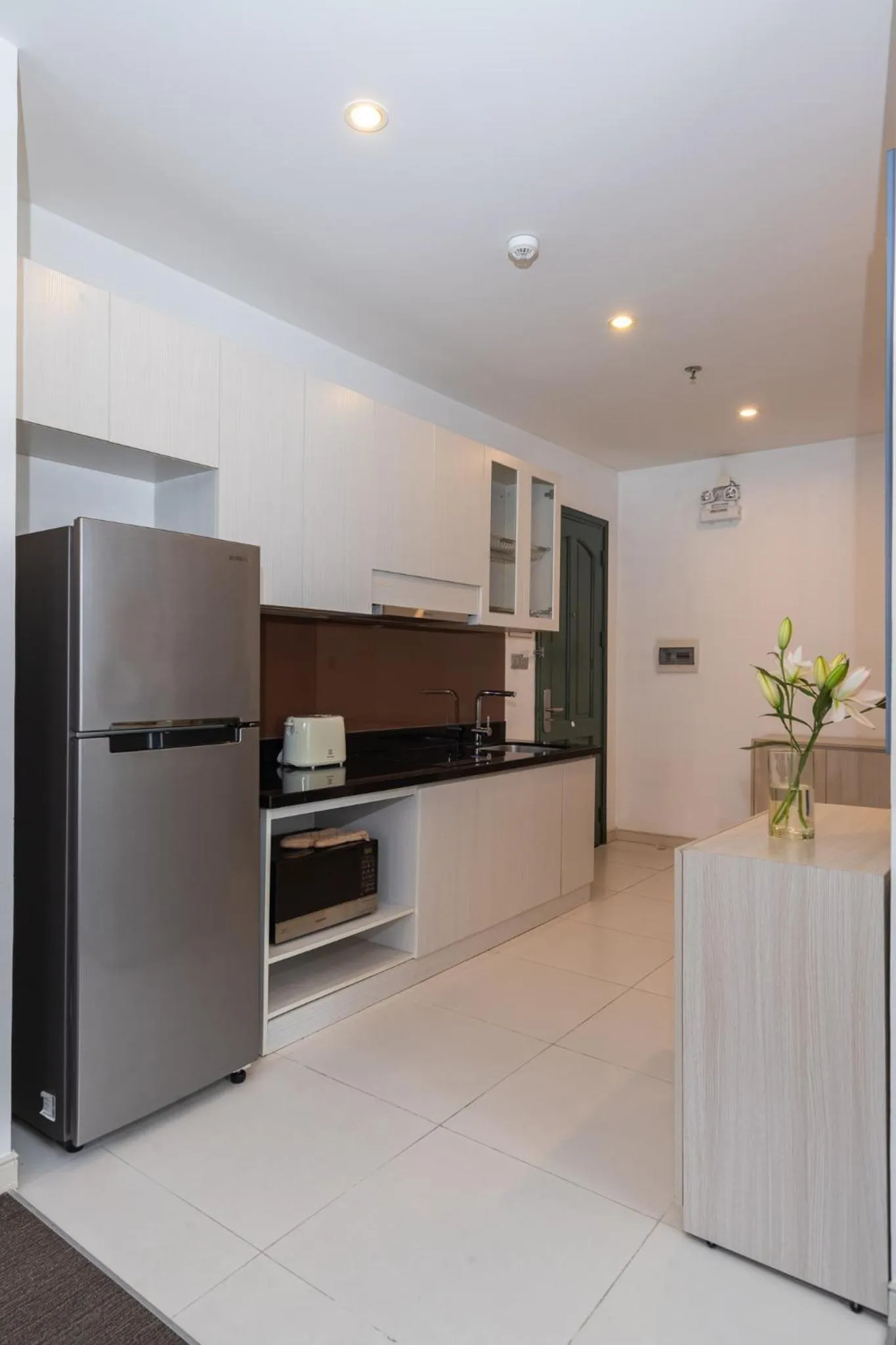 Kitchen or kitchenette in Đô Thành Residence by DDH