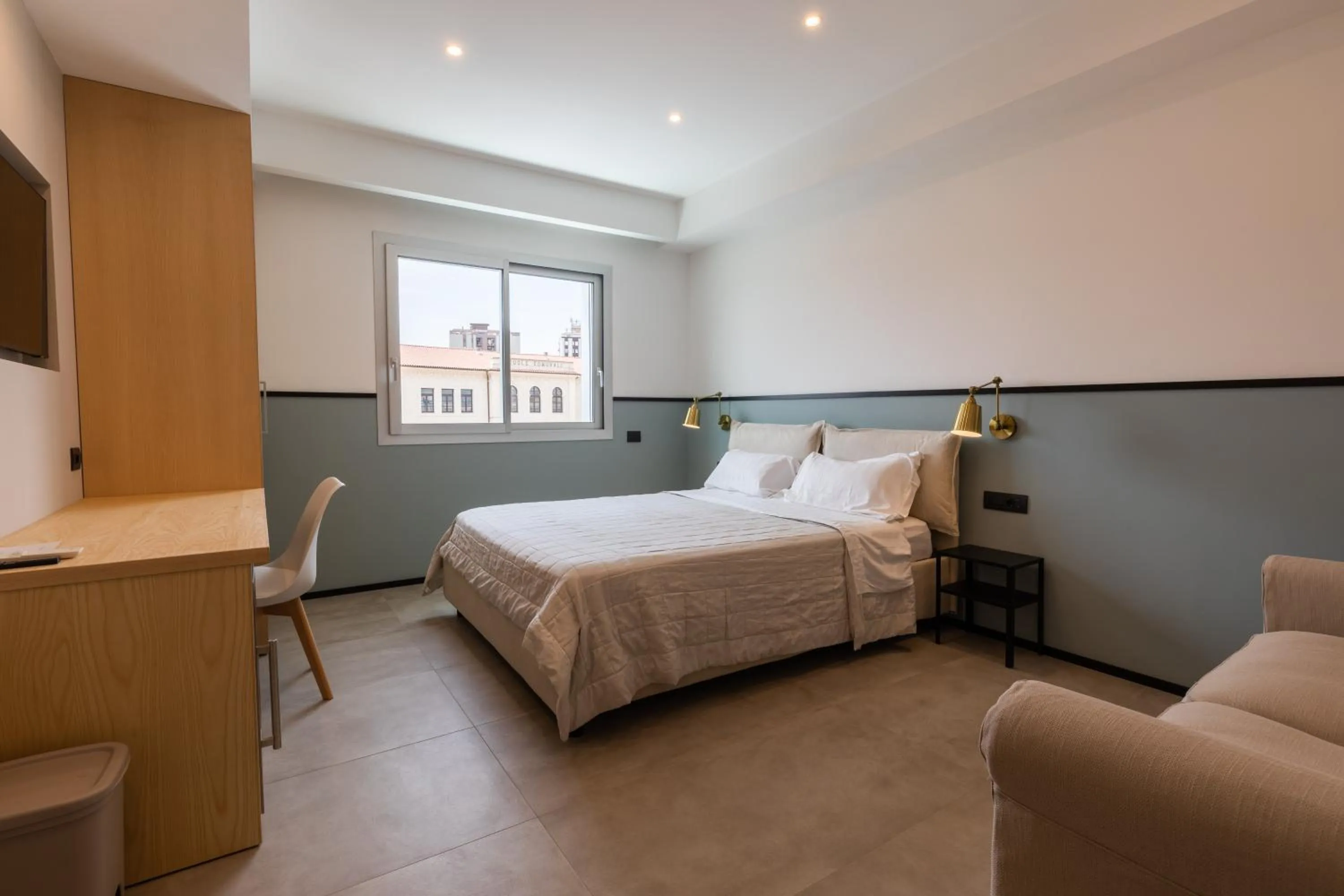 Bed in Antares Rooms and Suites